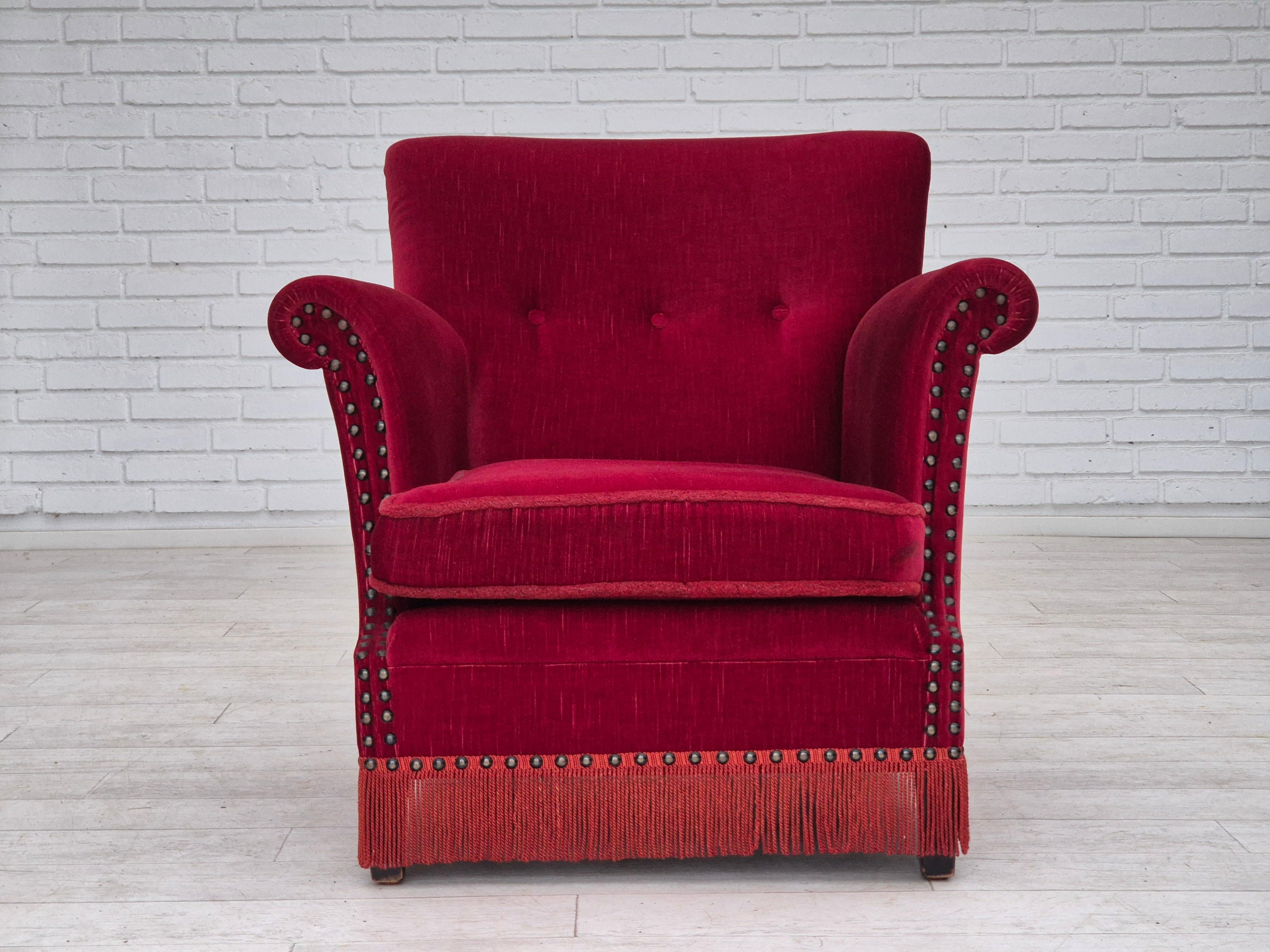 1970s, Danish lounge chair. Original very good condition: no smells and no stains. Original cherry-red furniture velour, beech wood legs. Original Scandinavian design directly from Denmark. Manufactured by Danish furniture maker in about 1965-1970s.