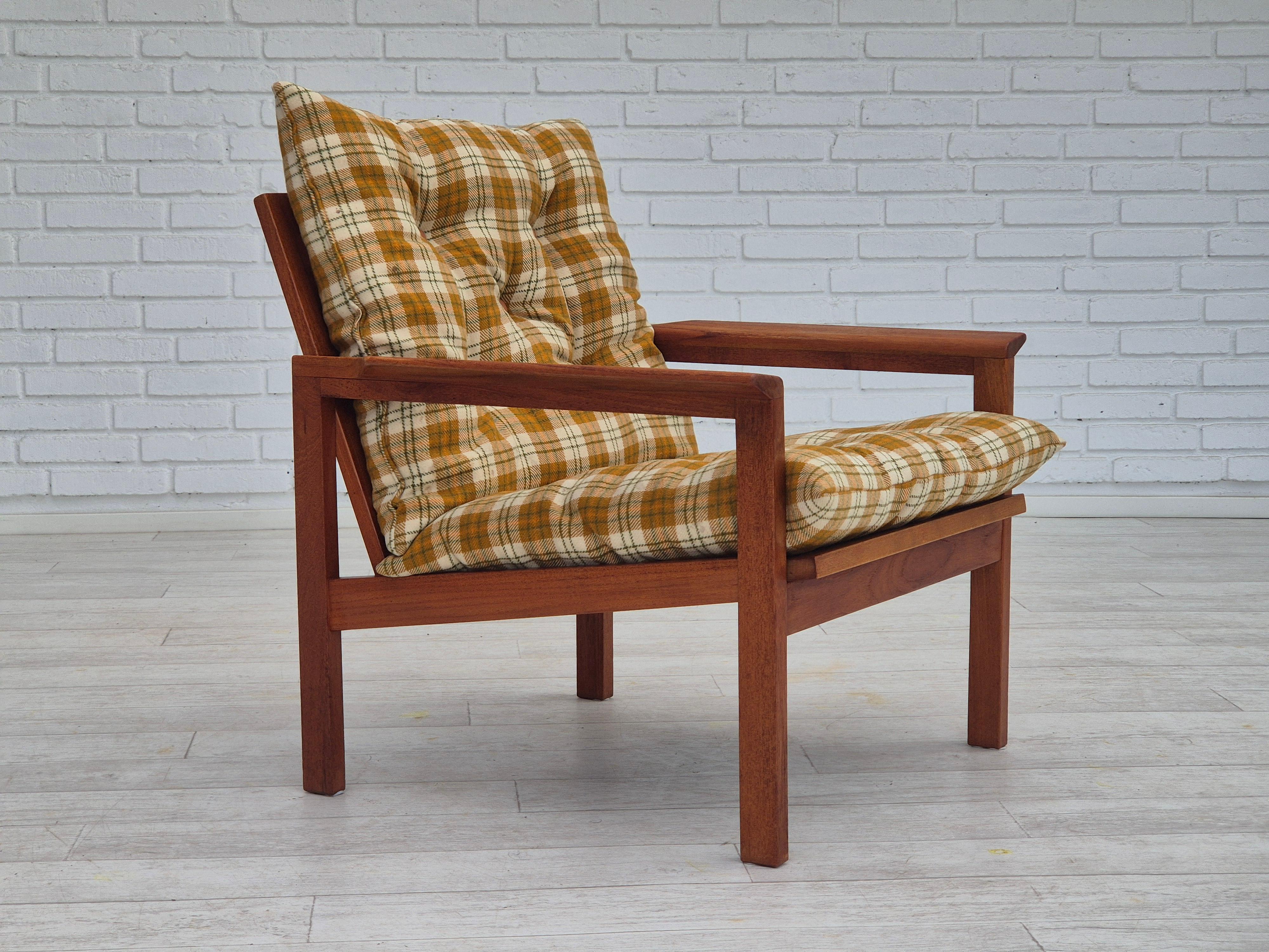1970s, Danish lounge chair in original very good condition: no smells and no stains. Multicolor furniture wool fabric, teak wood. Light brown leather buttons. Wood construction renewed. Manufactured by Danish furniture manufacturer in about 1970s.