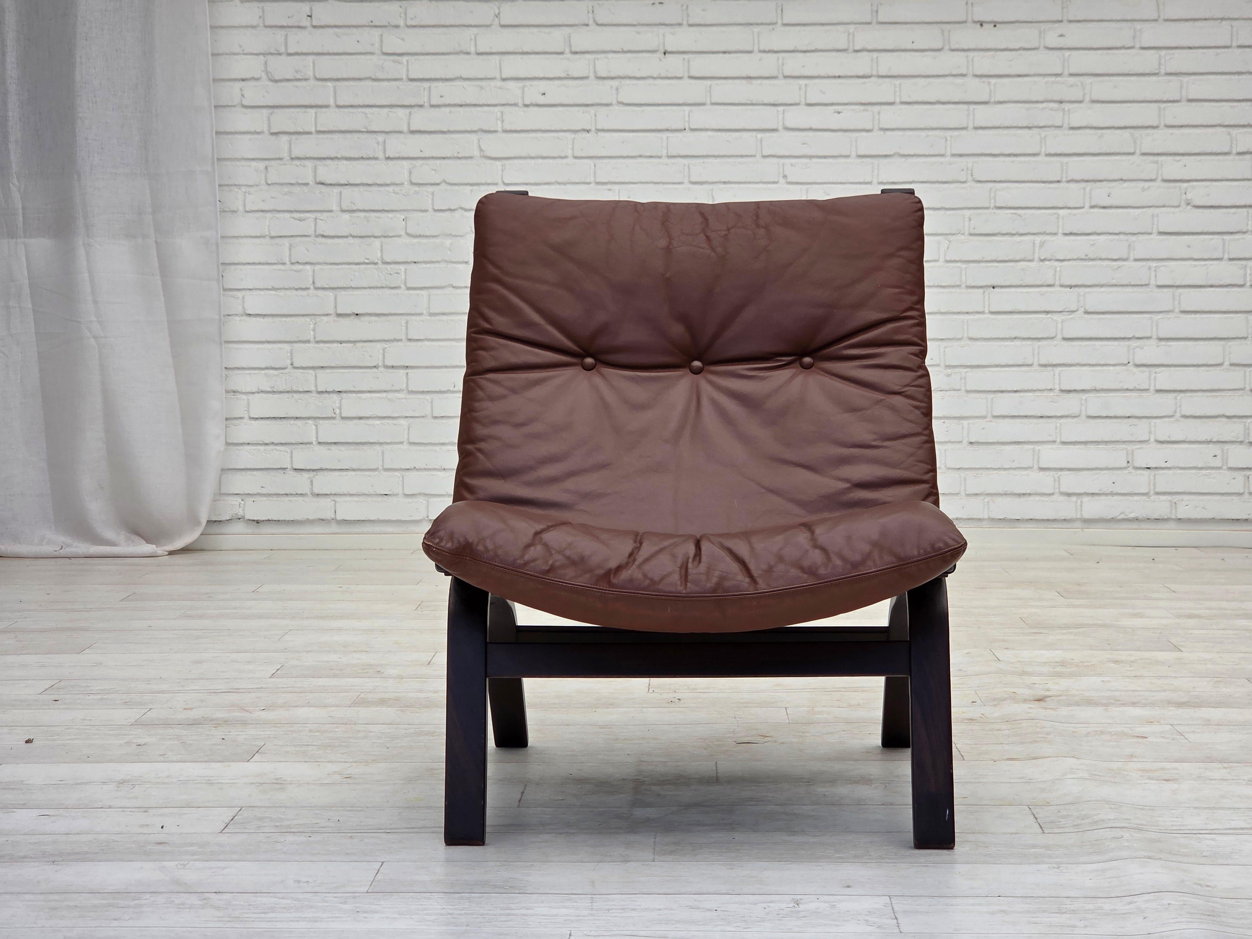 1970s, Danish loungechair by Farstrup. Original brown furniture leather, canvas, bent wood. Original very good condition: no smells, no stains and stable construction. Manufactured by Danish furniture maker Farstrup in about 1970-75s. Original