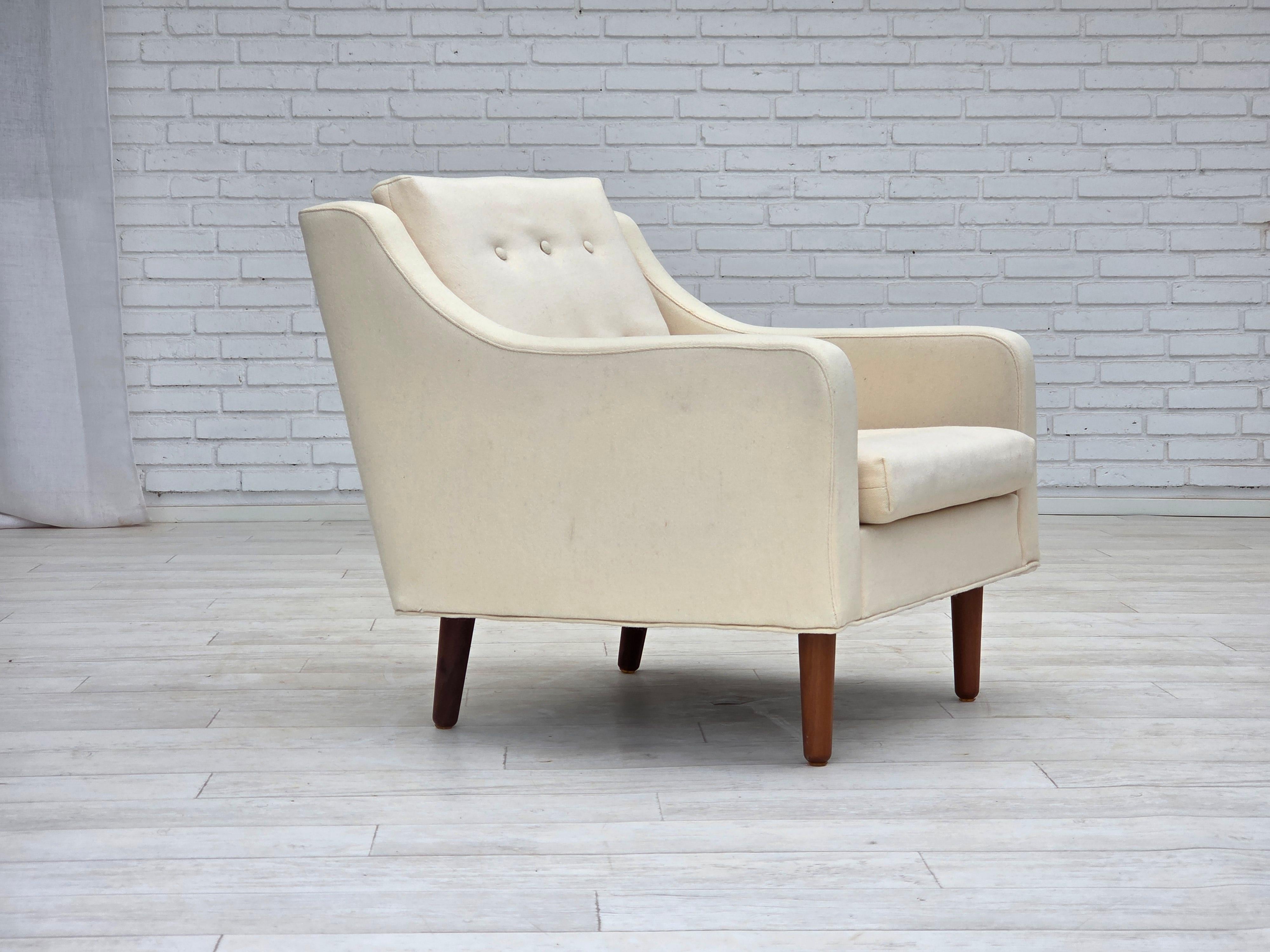 1970s, Danish loungechair. Beige/white furniture wool, teak wood legs. Chair was reupholstered by craftsman about 15 years ago. Manufactured by Danish furniture maker in about 1970-75s. Very good condition: no smells, no stains and stable