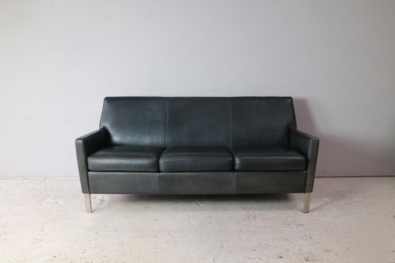 A late 1970s 3-seat sofa with original black leather upholstery. A very stylish look and very comfortable.
  