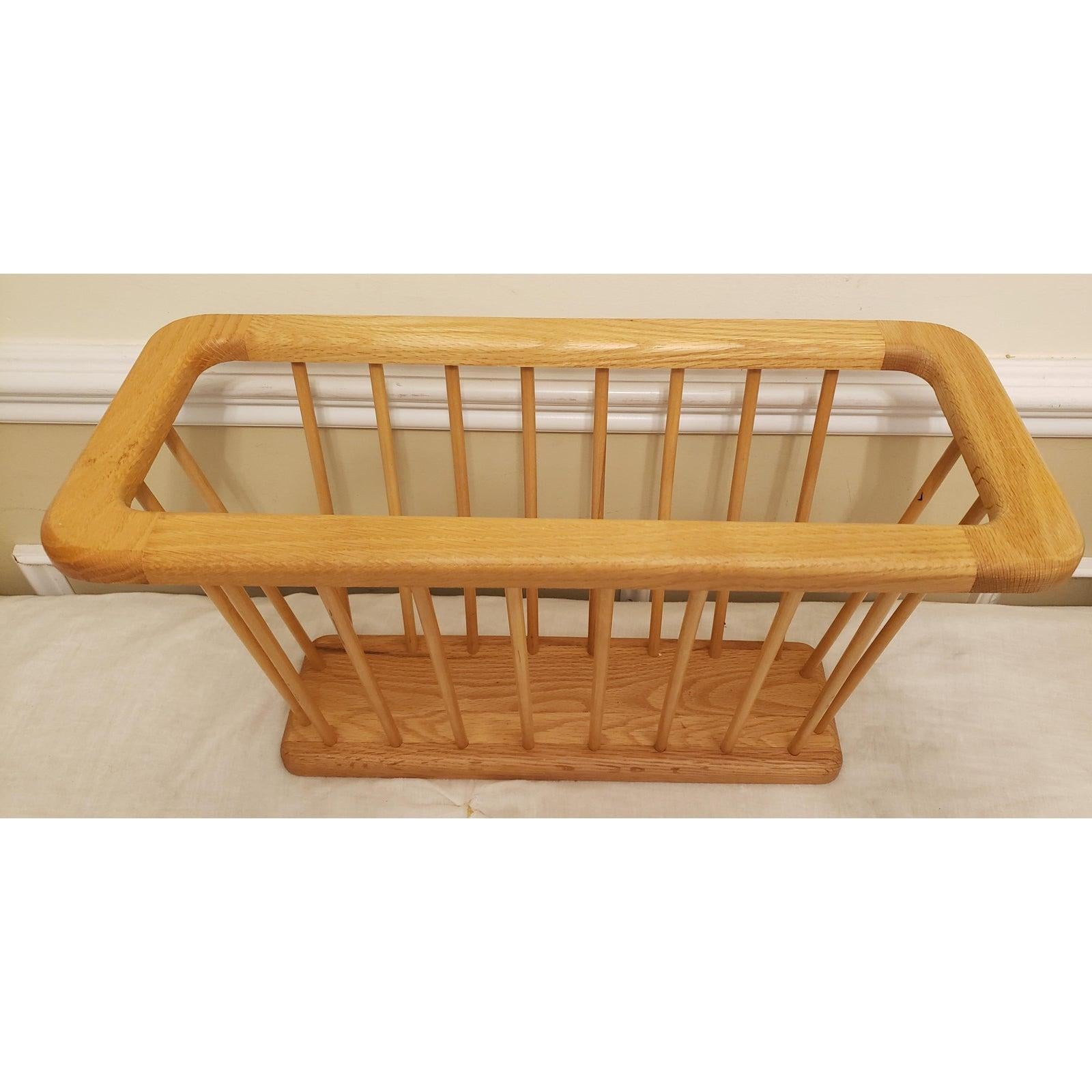 Nice Danish Modern style oval wooden magazine holder. Mid century design, Arthur Umanoff Style, a simple sleek wood rack. It has a one-piece wood top and bottom and wood spindle sides. Many uses such as a magazine or newspaper holder, a rack for