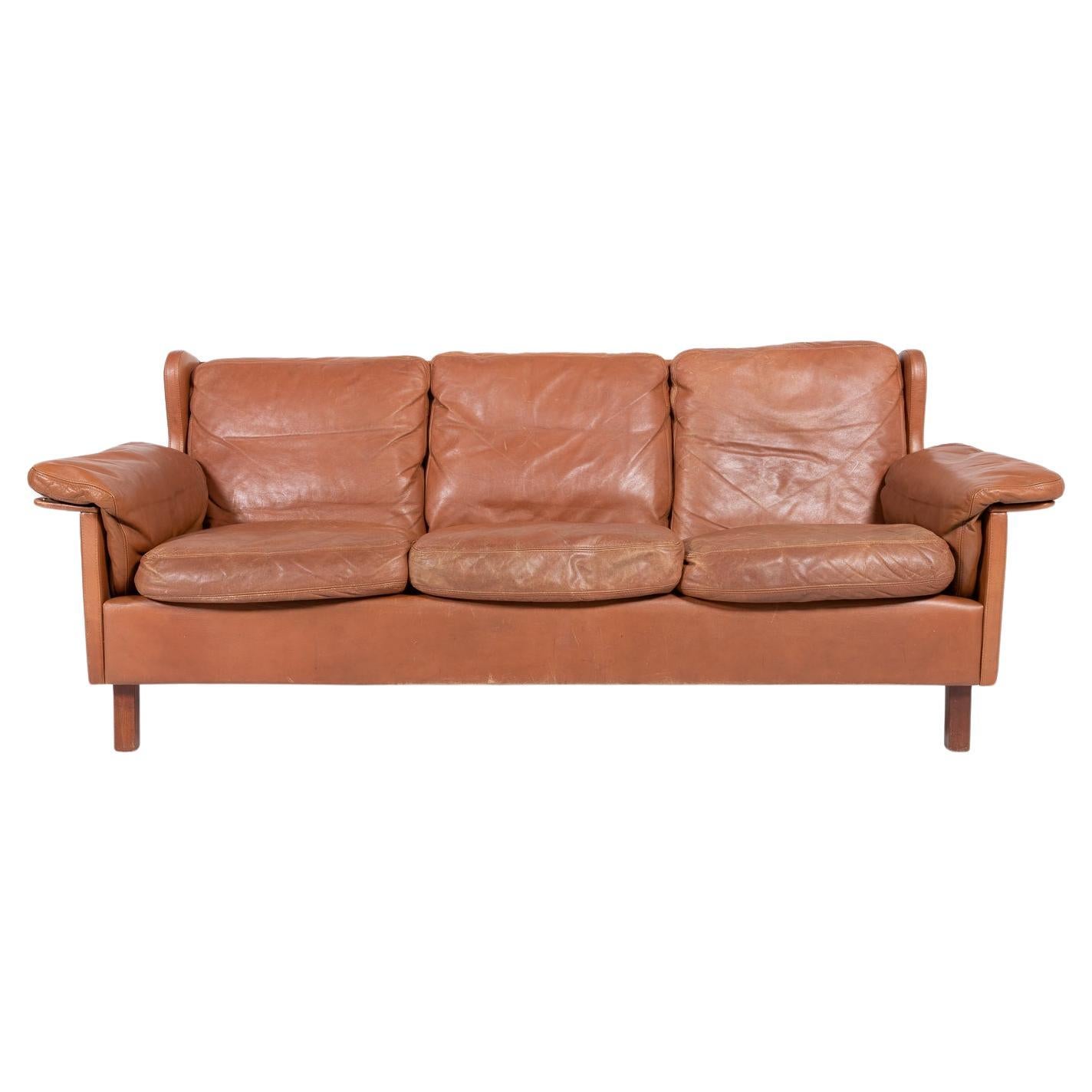 1970’s Danish Modern cognac leather Wing sofa For Sale