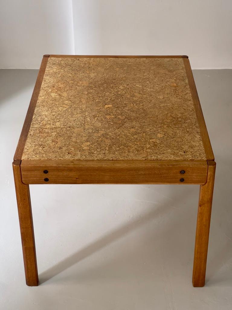 Hand-Crafted 1970s Danish modern dining table produced by FDB in solid oak and natural kork. For Sale