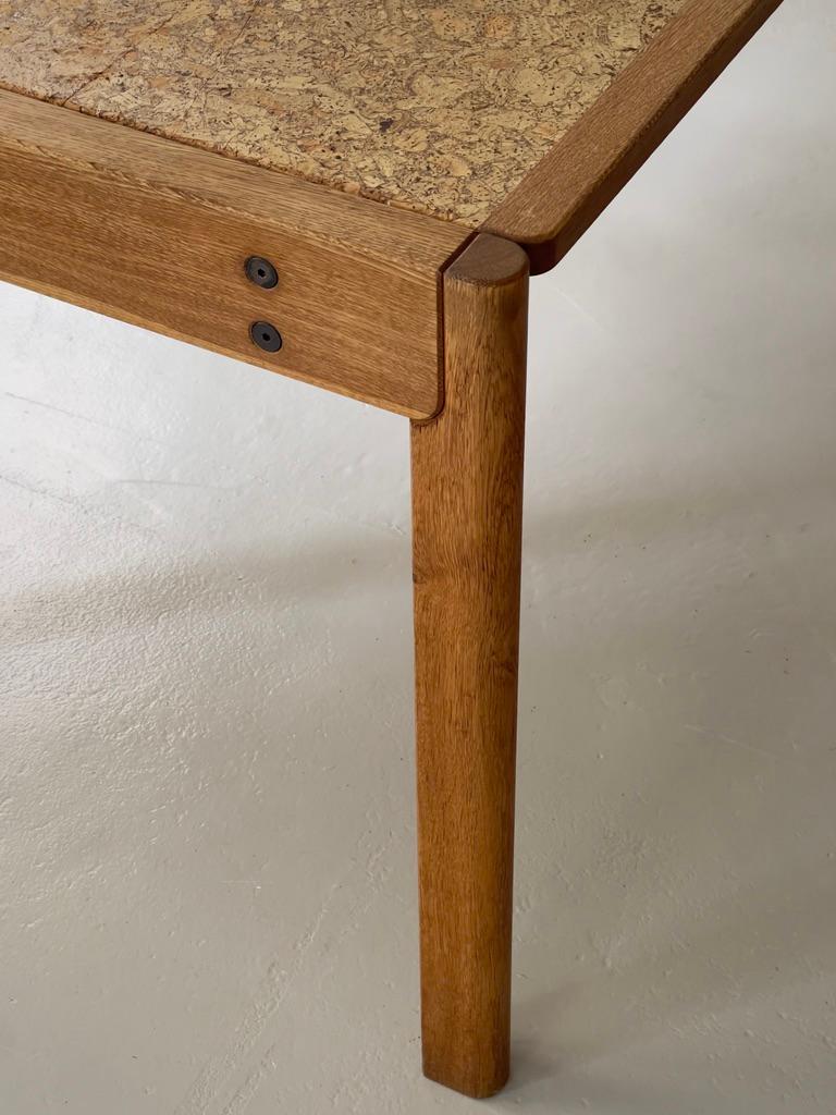 Late 20th Century 1970s Danish modern dining table produced by FDB in solid oak and natural kork. For Sale