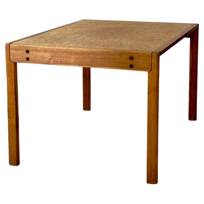 1970s Danish modern dining table produced by FDB in solid oak and natural kork. For Sale