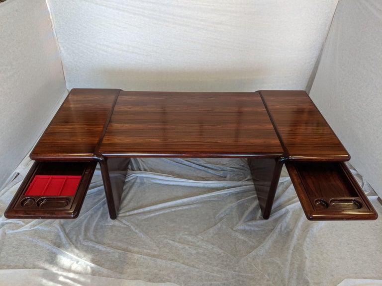 Early production Dyrlund Supreme executive desk in rosewood.

This item contains a material that cannot be shipped outside of the contiguous United States.

From the Supreme model line. Unique gullwing design with grand proportions. Striking