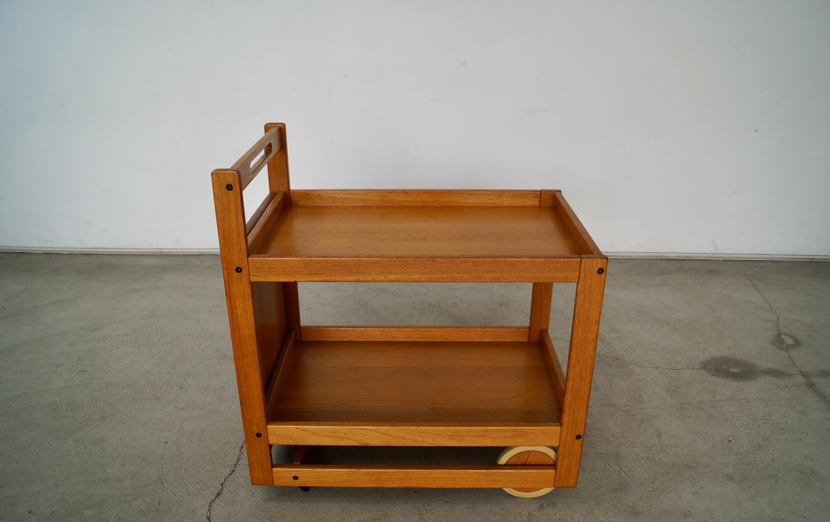 Vintage original Midcentury Modern bar cart for sale. Designed by Jens Quistgaard for Nissen, and is all original. It's made of teak, and has a removable teak butcher block cutting board tray. It's a unique and rare piece by Nissen, and is in great