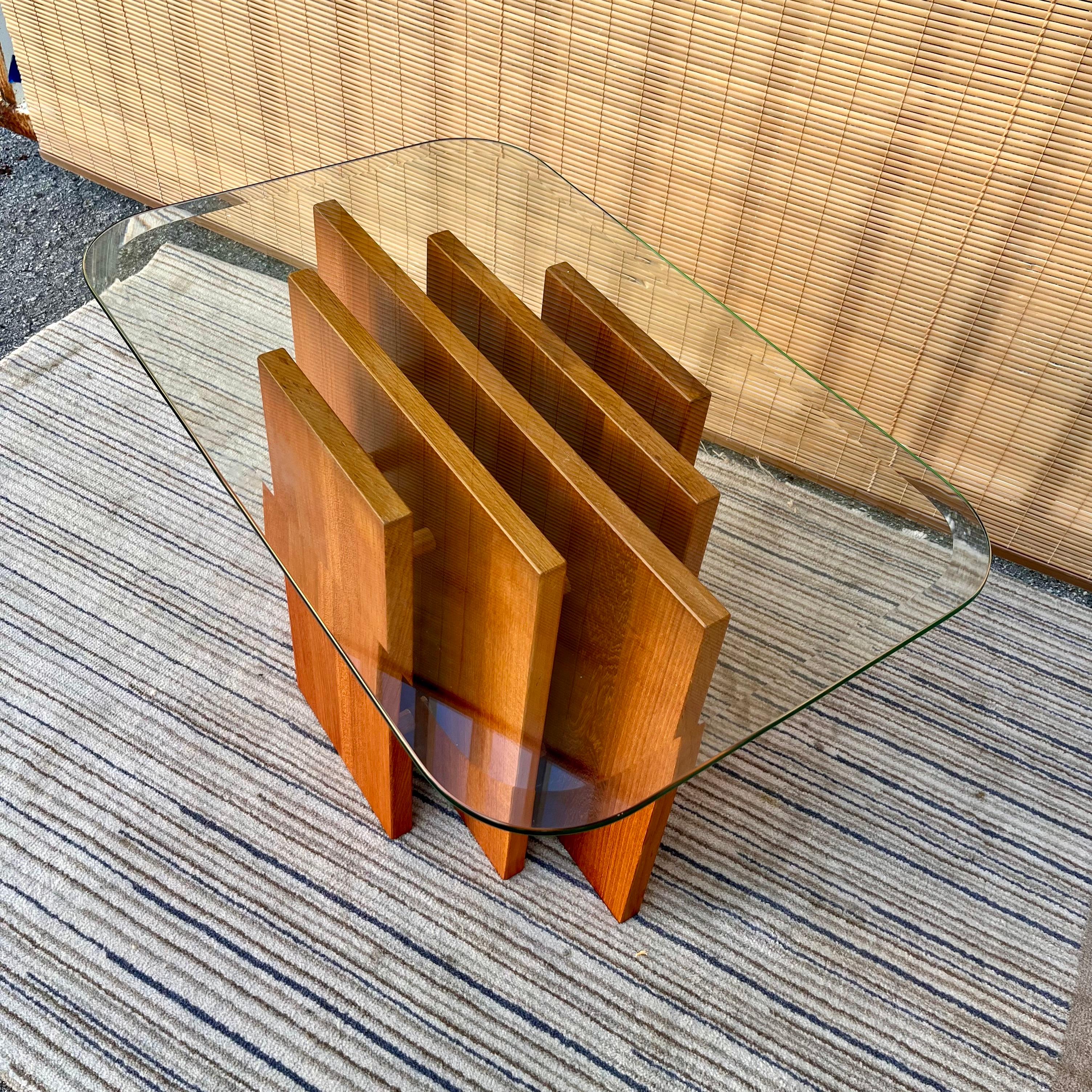 Mid Century Danish Modern side / end table in the Gustav Gaarde for Trekanten Style. Circa 1970s 
Features a sculptured teak base formed by individual panels held together with solid wood round bars and topped with a 3/8