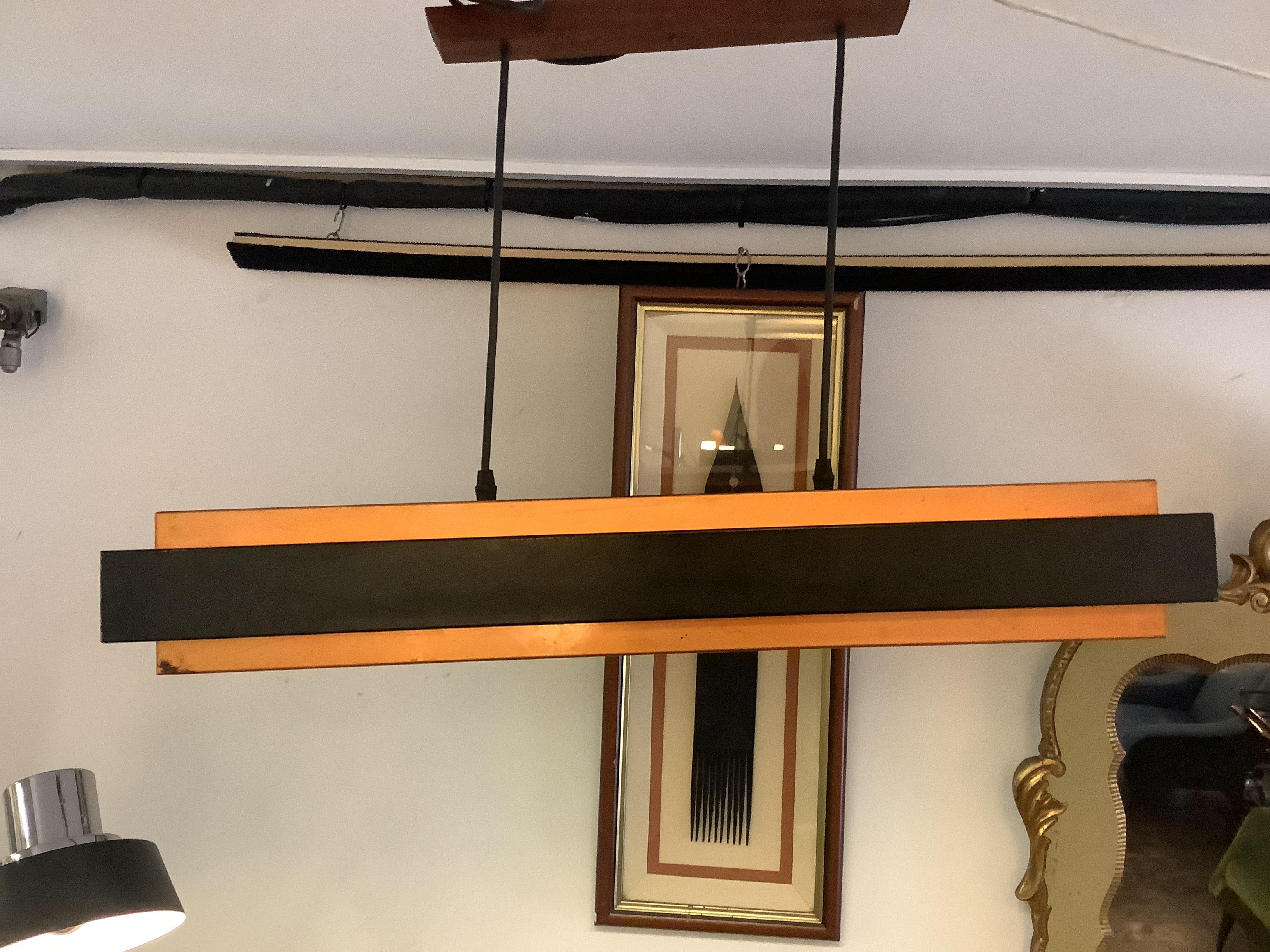 Aluminum and copper rectangle shape pendant lamp black band by Danish modern lighting manufacturing
 Company Fog & Morup was founded by Ansgar Fog and Erik Morup in Aarhus,Denmark in 1904.