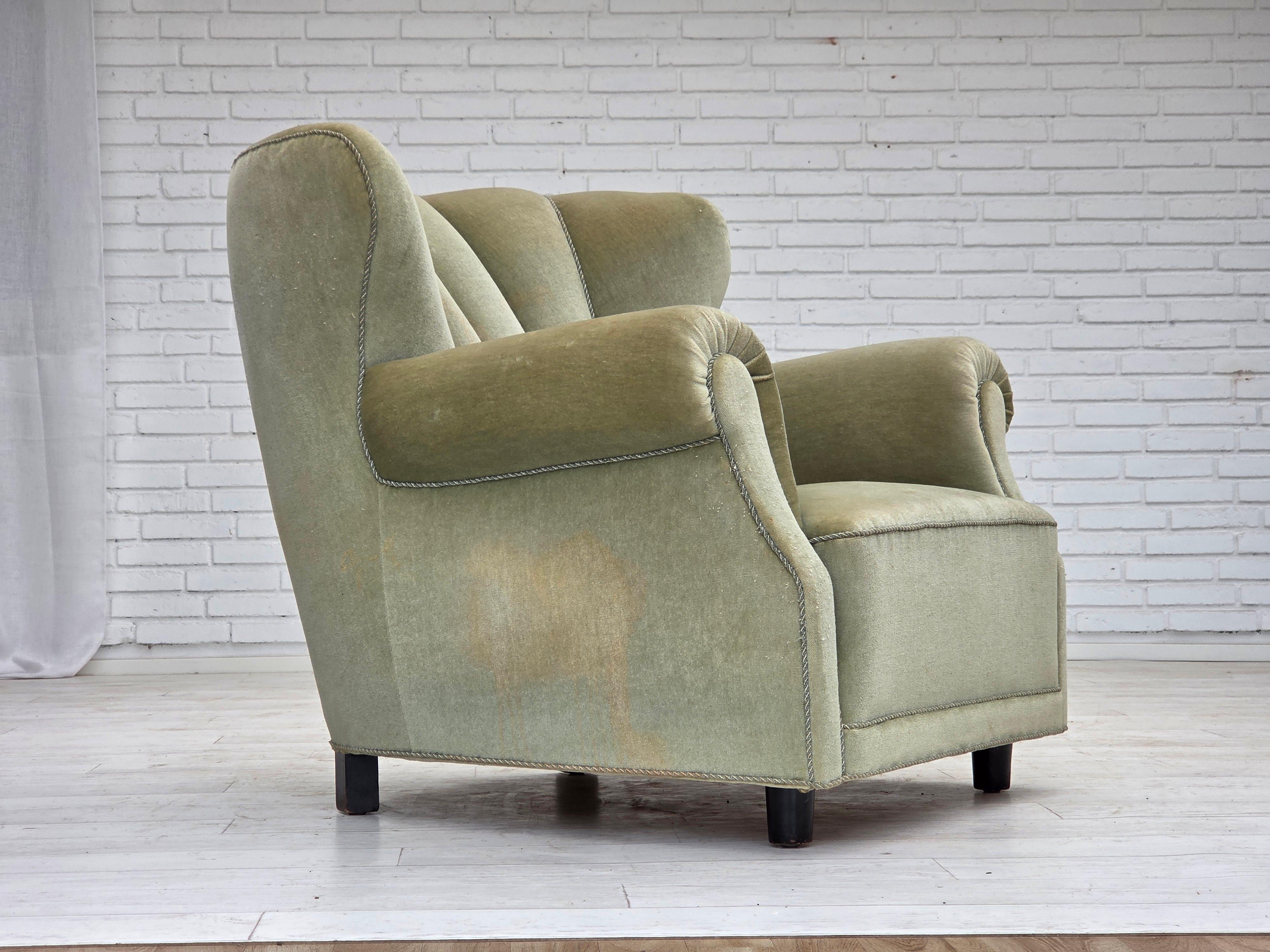 1970s, Danish relax armchair. Original good condition: no smells, no stains and stable construction. Slightly signs of wear. Original light green furniture velour, beech wood legs, brass springs in the seat. Manufactured by Danish furniture maker in