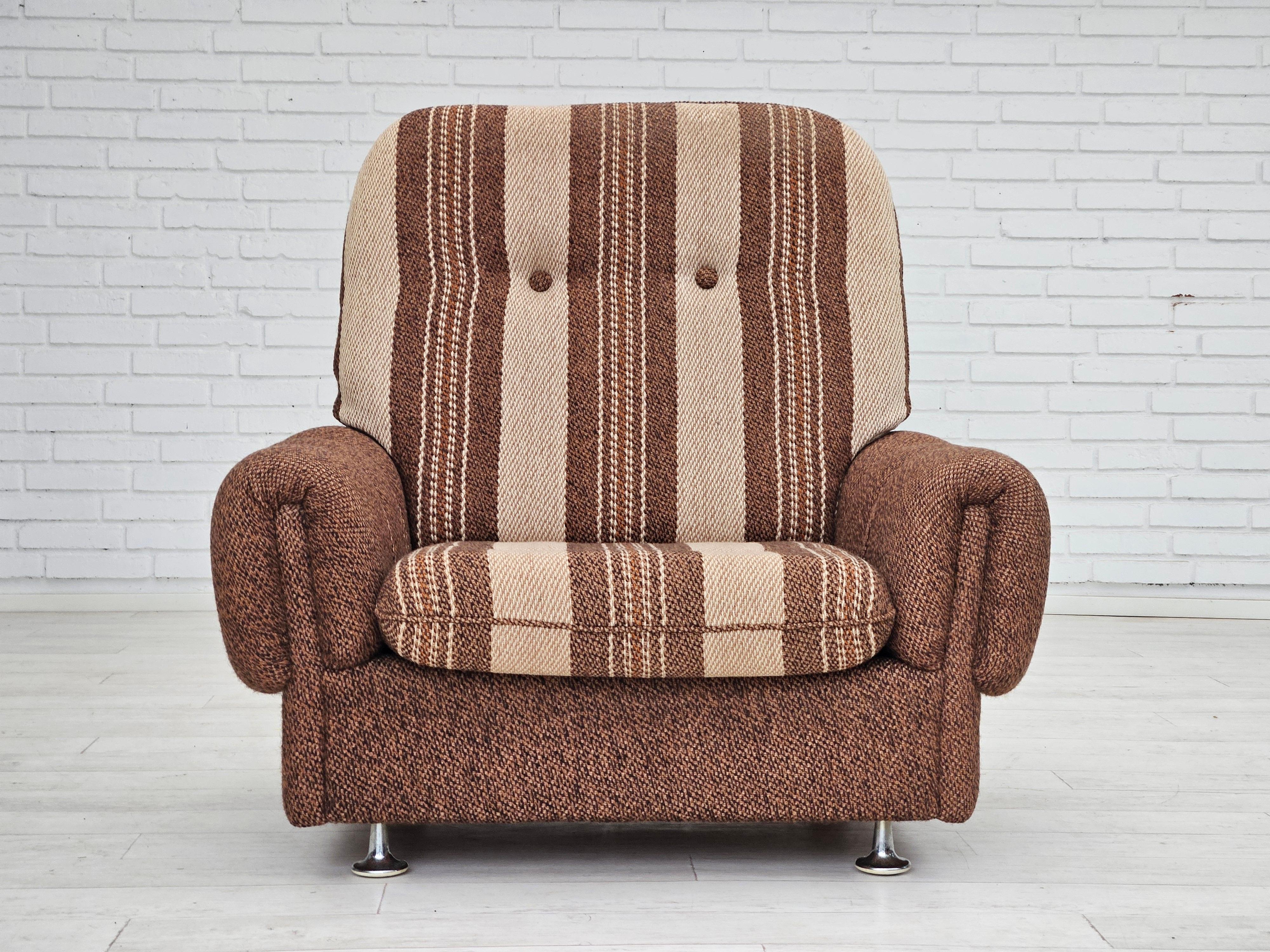 1970s, Danish relax chair in original very good condition: no smells and no stains. Furniture wool in brown and beige colors. Removable seat cushion, chrome wheels, and legs. Manufactured by Danish furniture manufacturer in about 1970s.