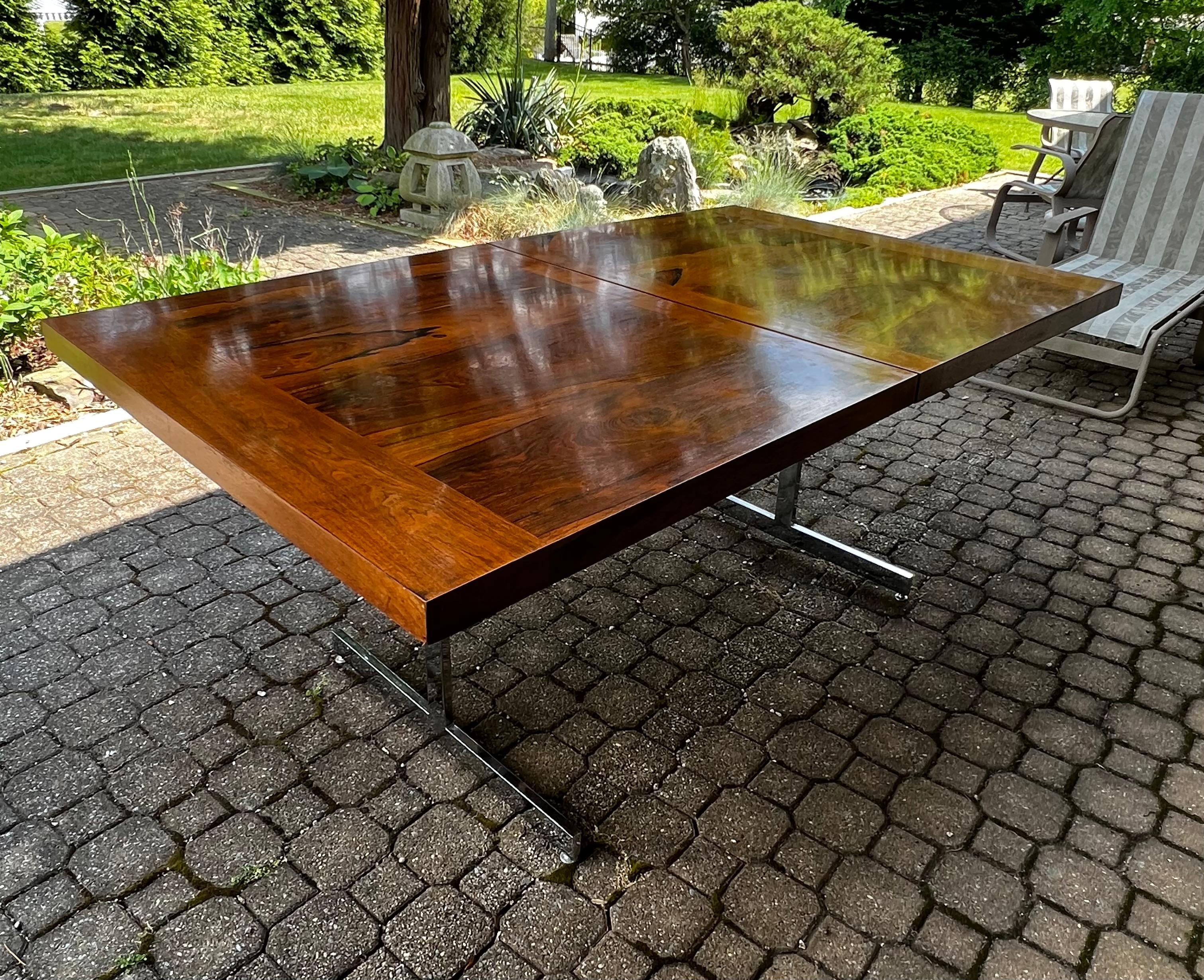 Stunning 1970s extension rosewood dining table with a chrome base attributed to Milo Baughman . 
Table is 42”x72”x29.5”H and has (2) 18” extensions, with both extensions are 42”x108”x29.5”H
This table is pure luxury !