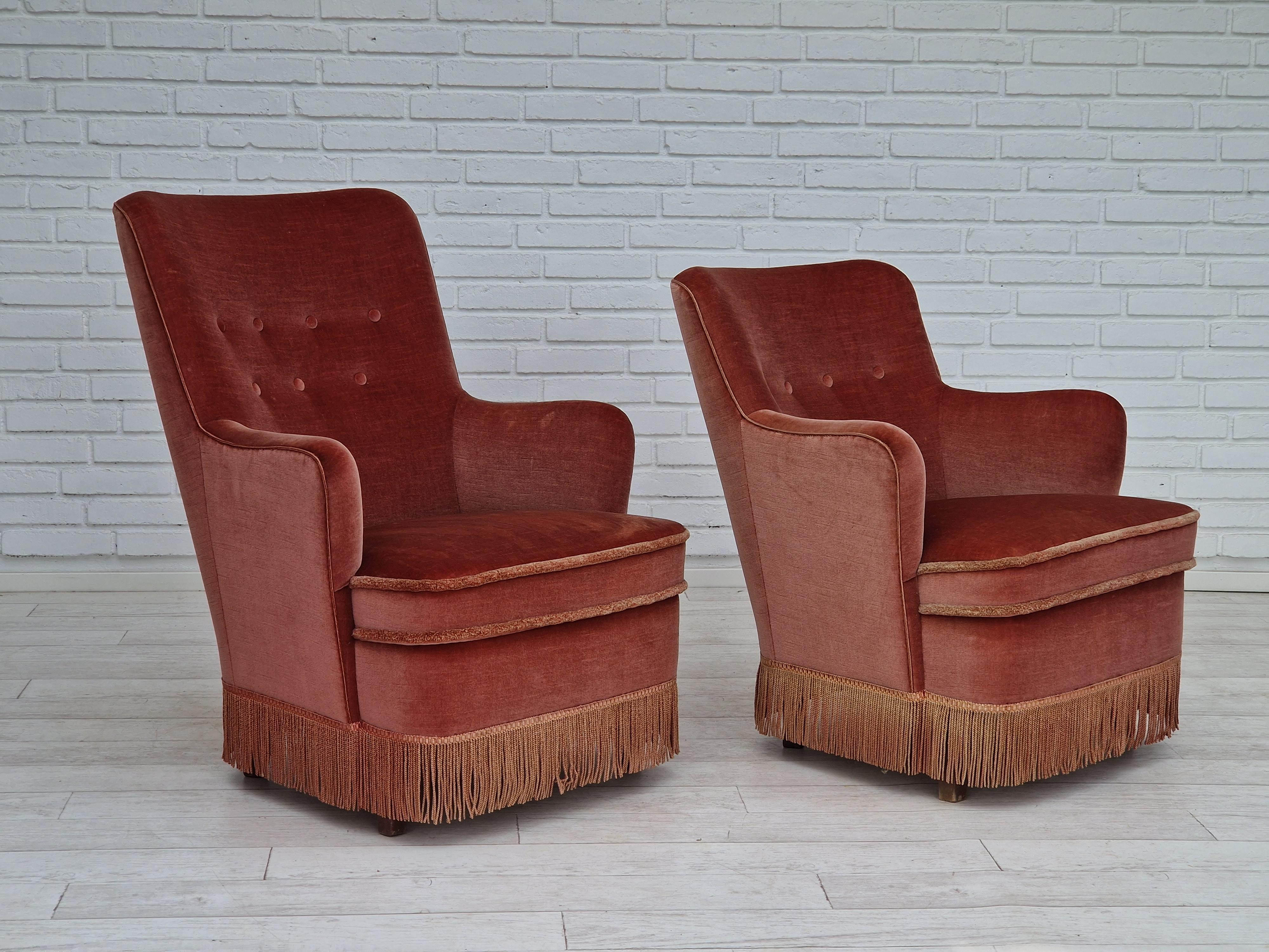 1970s, Danish design. Set of two velour chairs. Original upholstery in light red velour with nice patina, very good condition. Beech wood legs, springs in the seat. No smells, no stains. Made in about 1970 by Danish furniture manufacturer. (high of