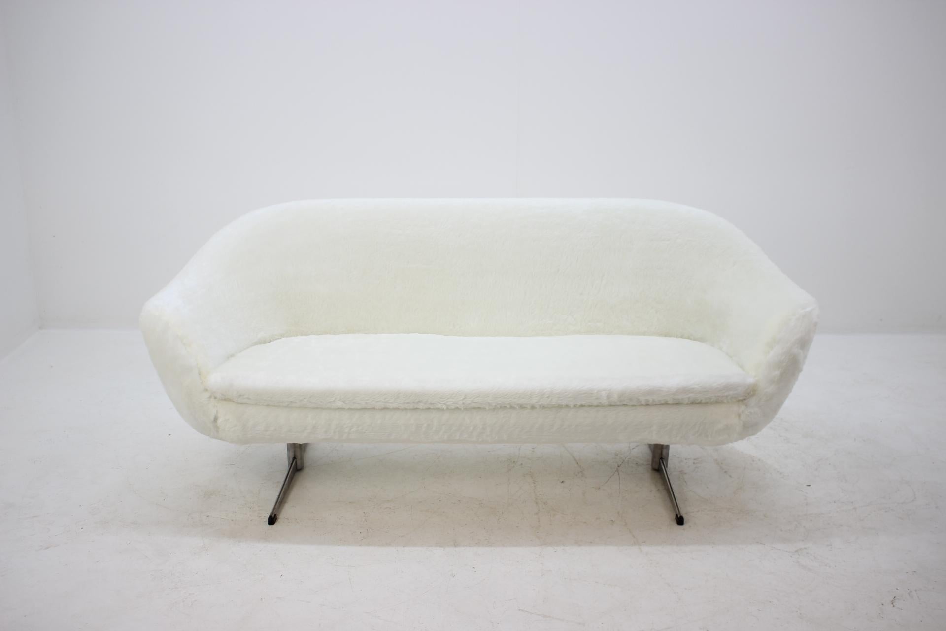 Newly upholstered in synthetic sheep skin upholstery.