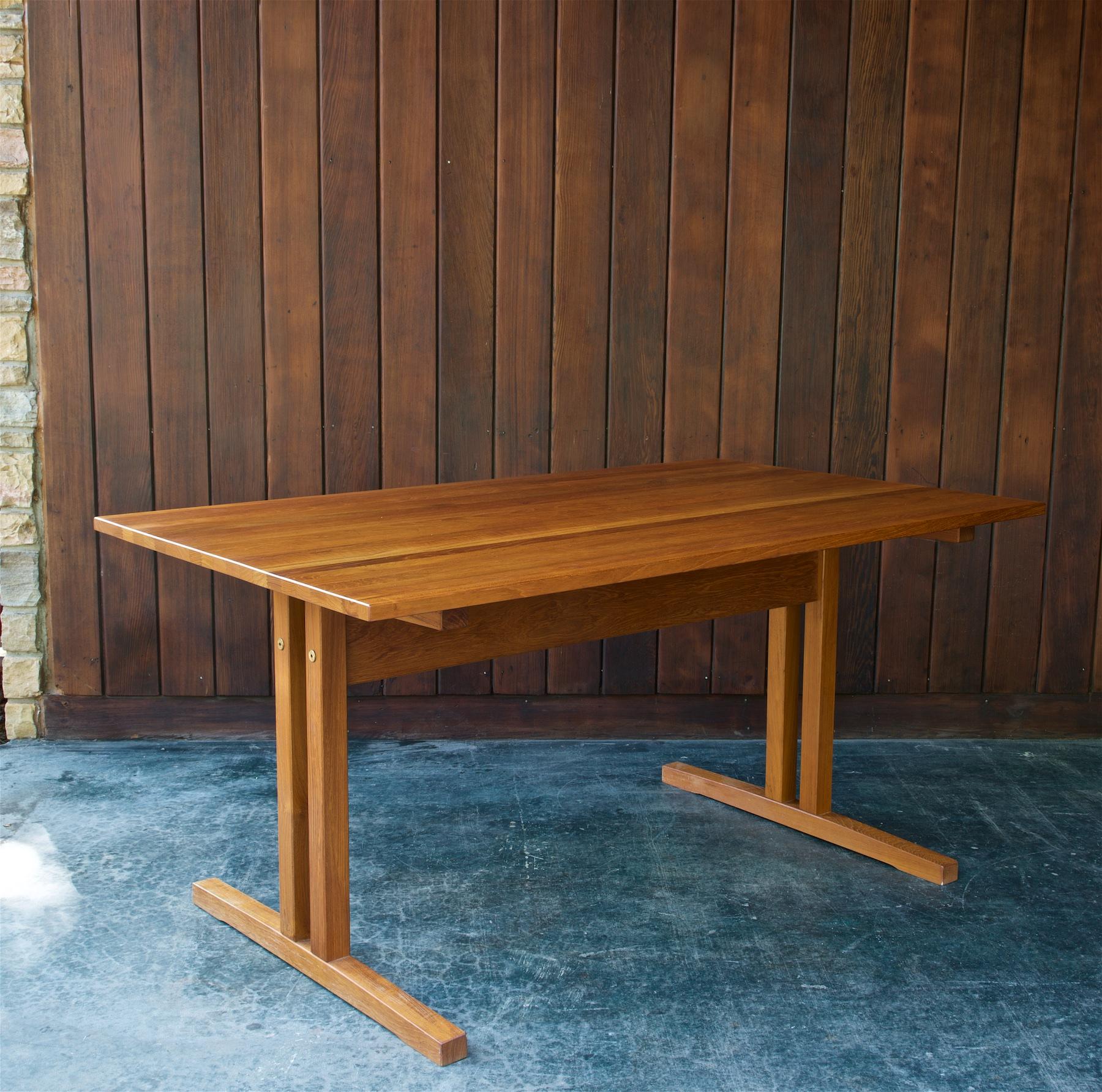 Attributed design to J.L. Moller, but we do not have a reference at this time.

A wonderful solid staved teak Danish Scandinavian desk/worktable, some light time-worn patina to work surface.  This table design is similar to the Charlotte Perriand