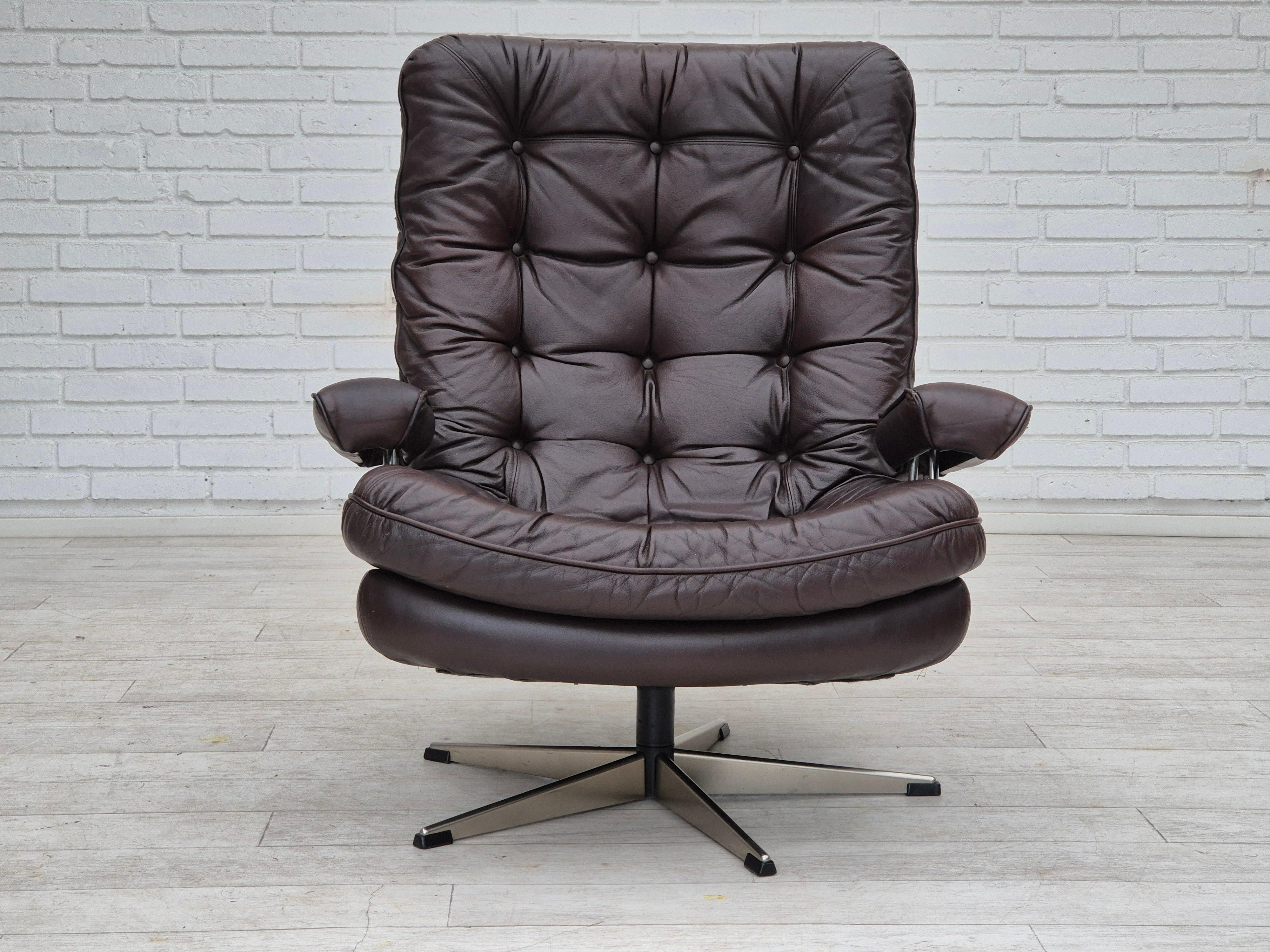 Scandinavian Modern 1970s, Danish swivel chair, original condition, brown furniture leather. For Sale