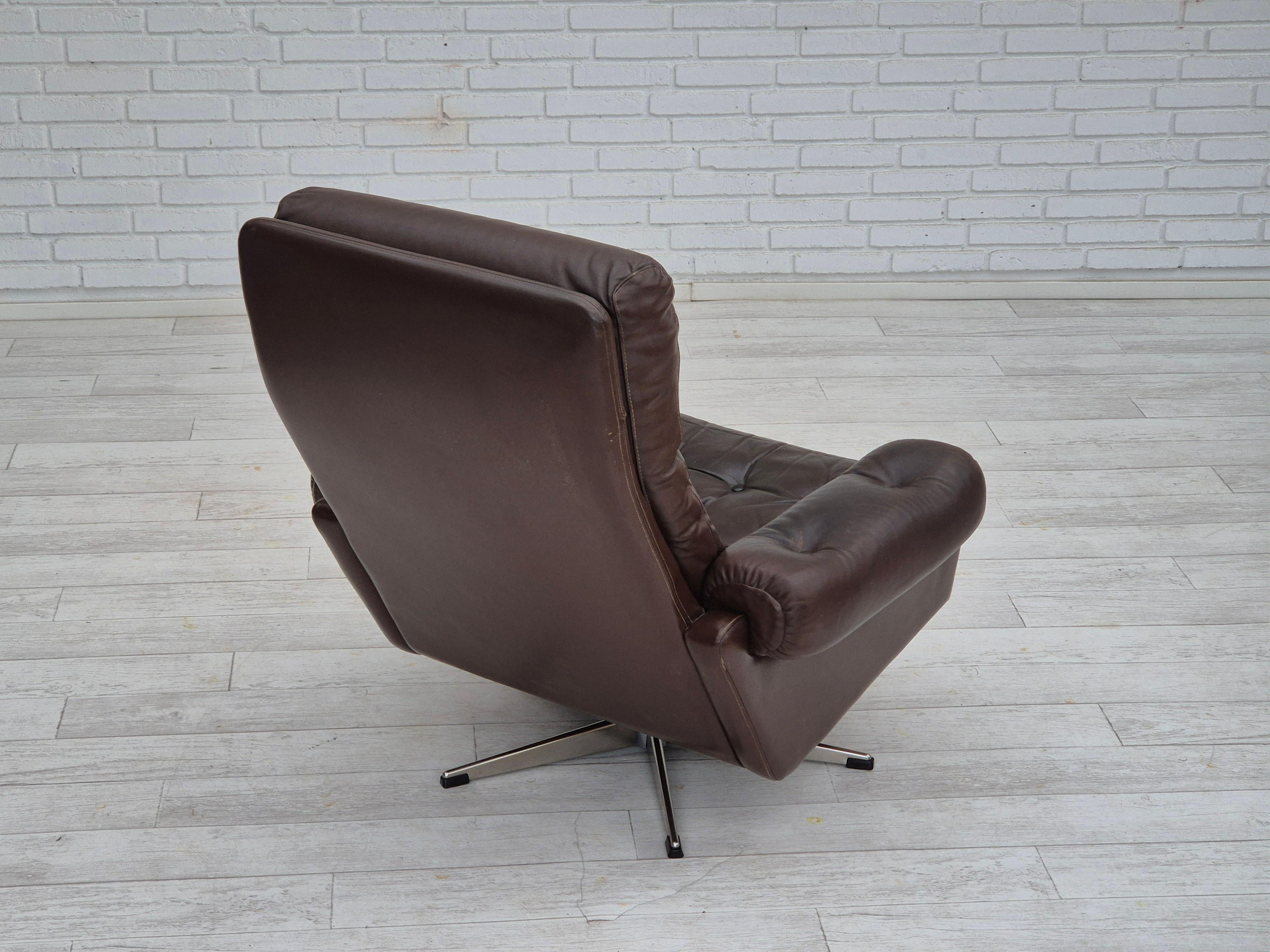 Scandinavian Modern 1970s, Danish swivel chair, original condition, brown furniture leather. For Sale