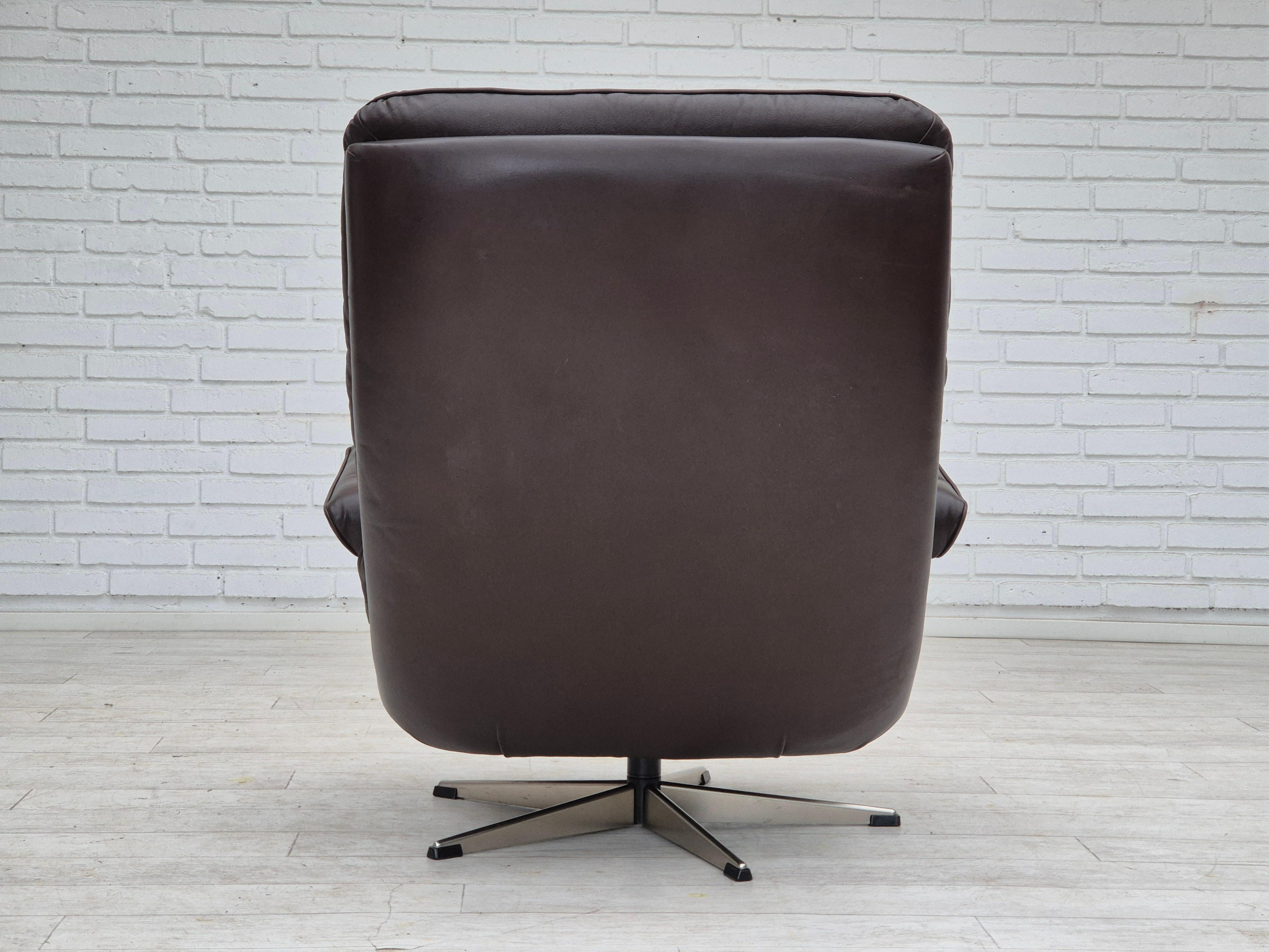 Steel 1970s, Danish swivel chair, original condition, brown furniture leather. For Sale