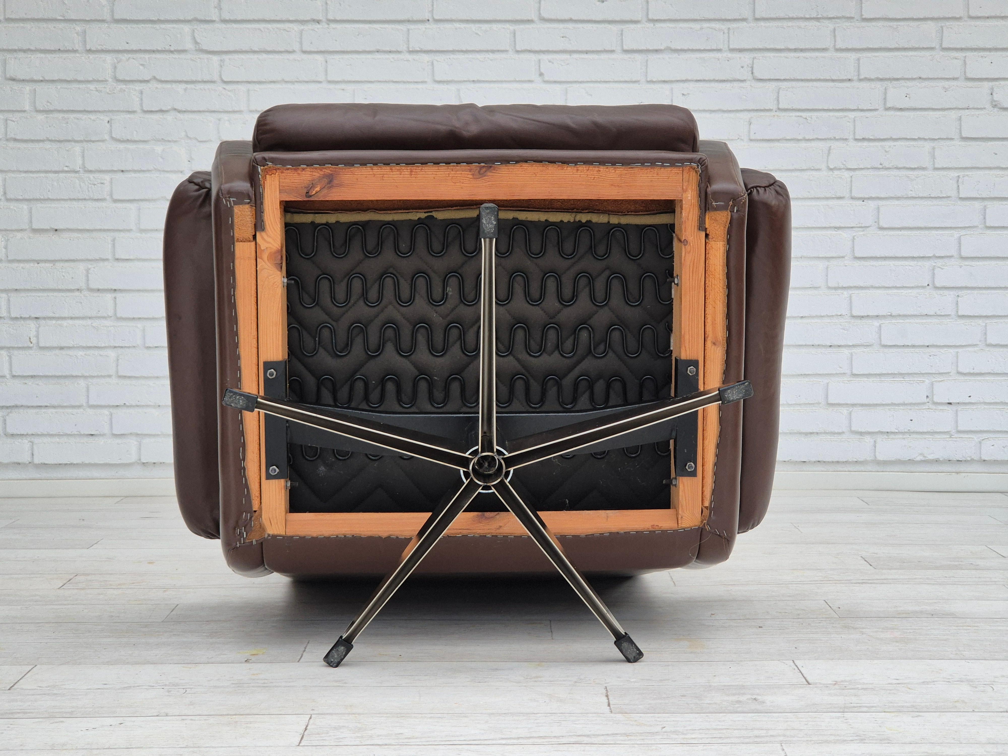 Steel 1970s, Danish swivel chair, original condition, brown furniture leather. For Sale