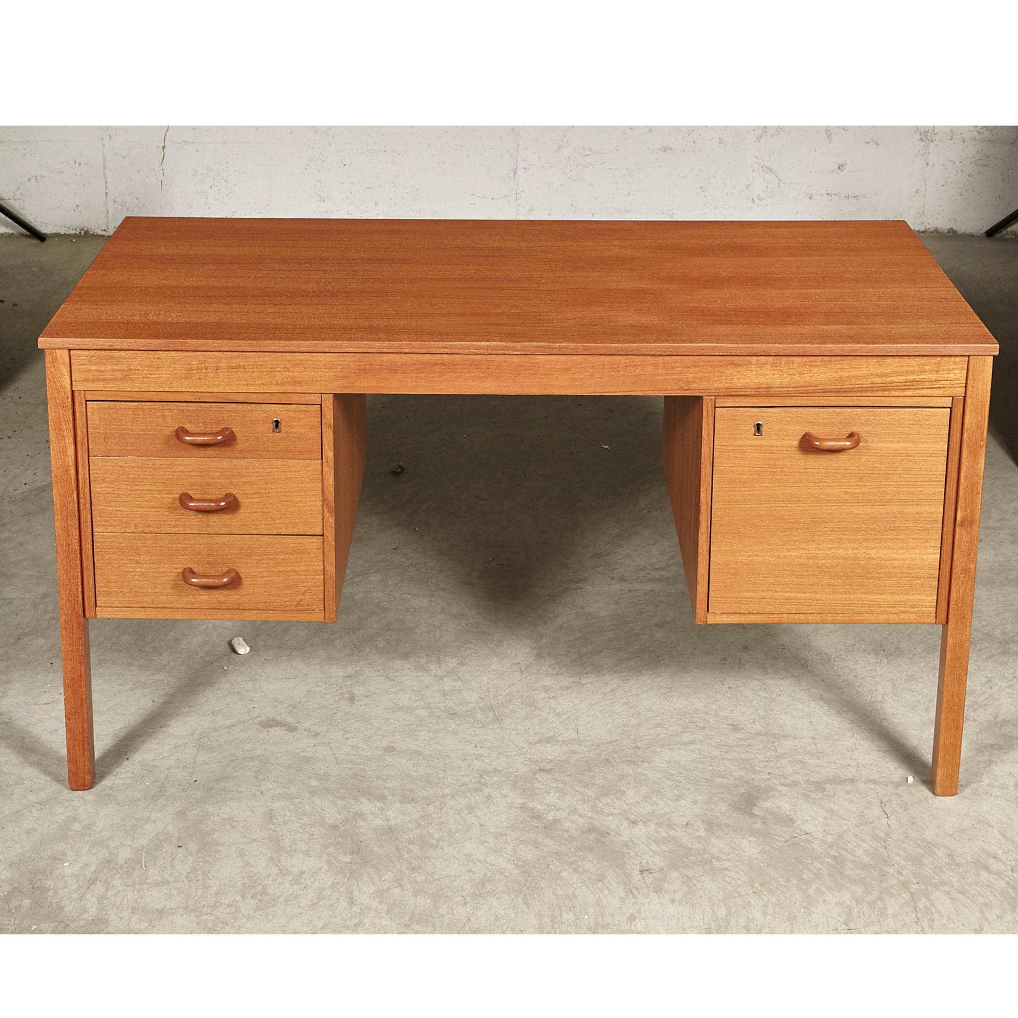 1970s Danish teak desk with four drawers for storage. Desk has rounded teak pulls. Desk opening: 20