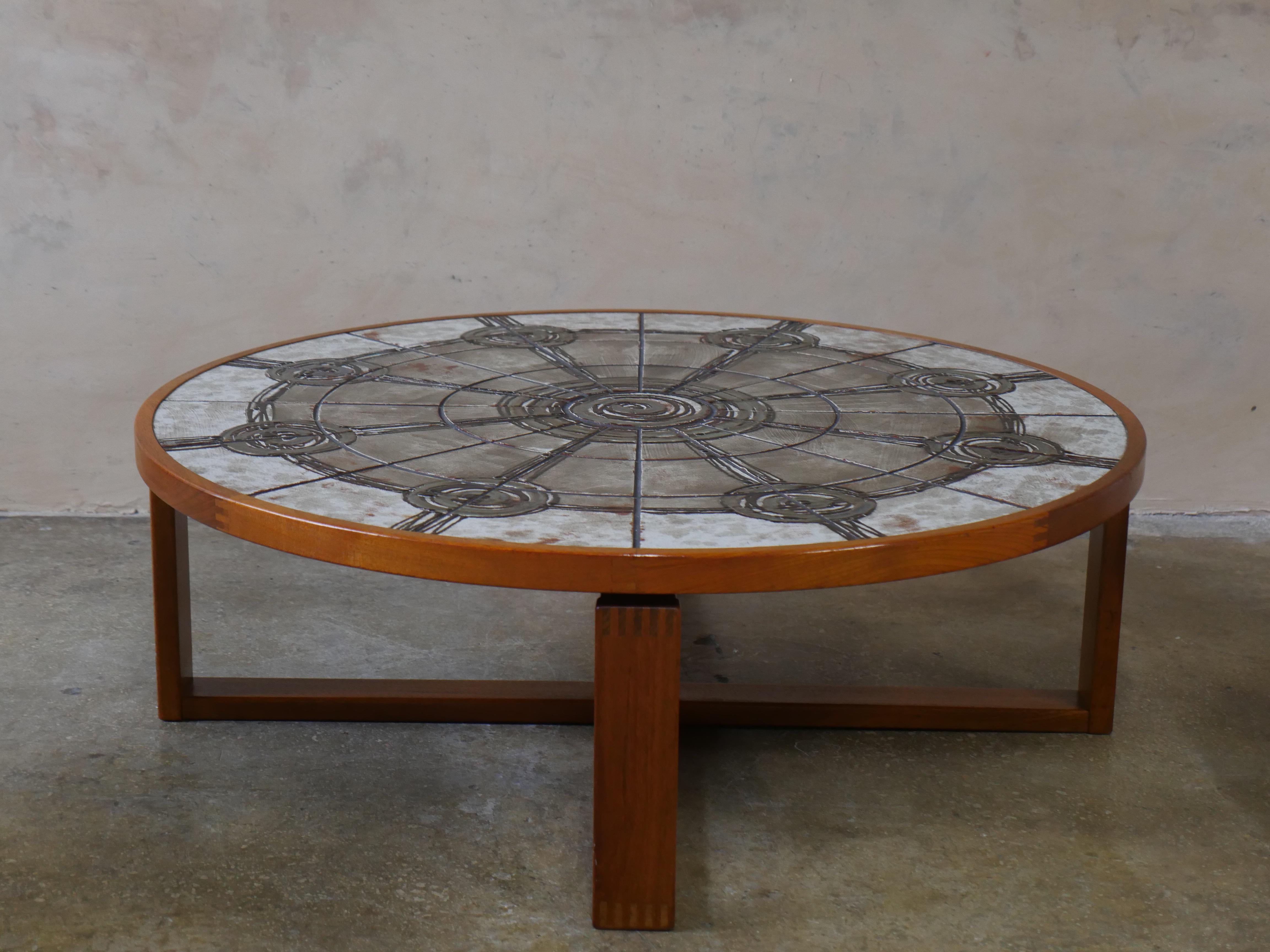 Beautiful teak coffee table by Ox art for Trioh Møbelfabrik, featuring a striking round ceramic tile top. This Brutalist table design makes a striking statement, with its warm teak wood and ceramic top creating a mood-setting contrast in any room.