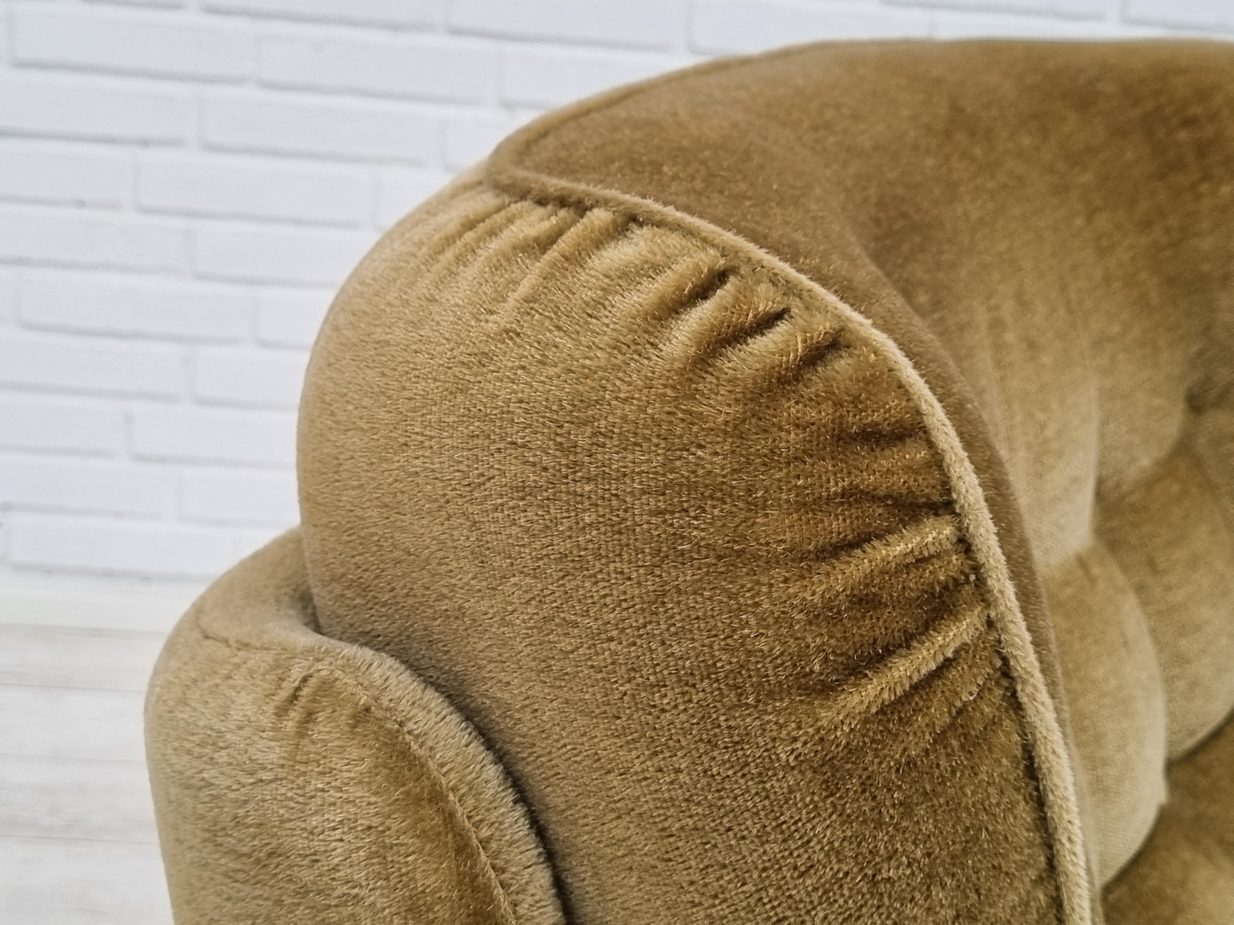 1970s, Danish high back armchair with loose backrest. Original upholstery in light green velour, very good condition.  Legs - original wheels, brass springs in the seat. No smells.  Very comfortable. Made in about 1970 by Danish furniture