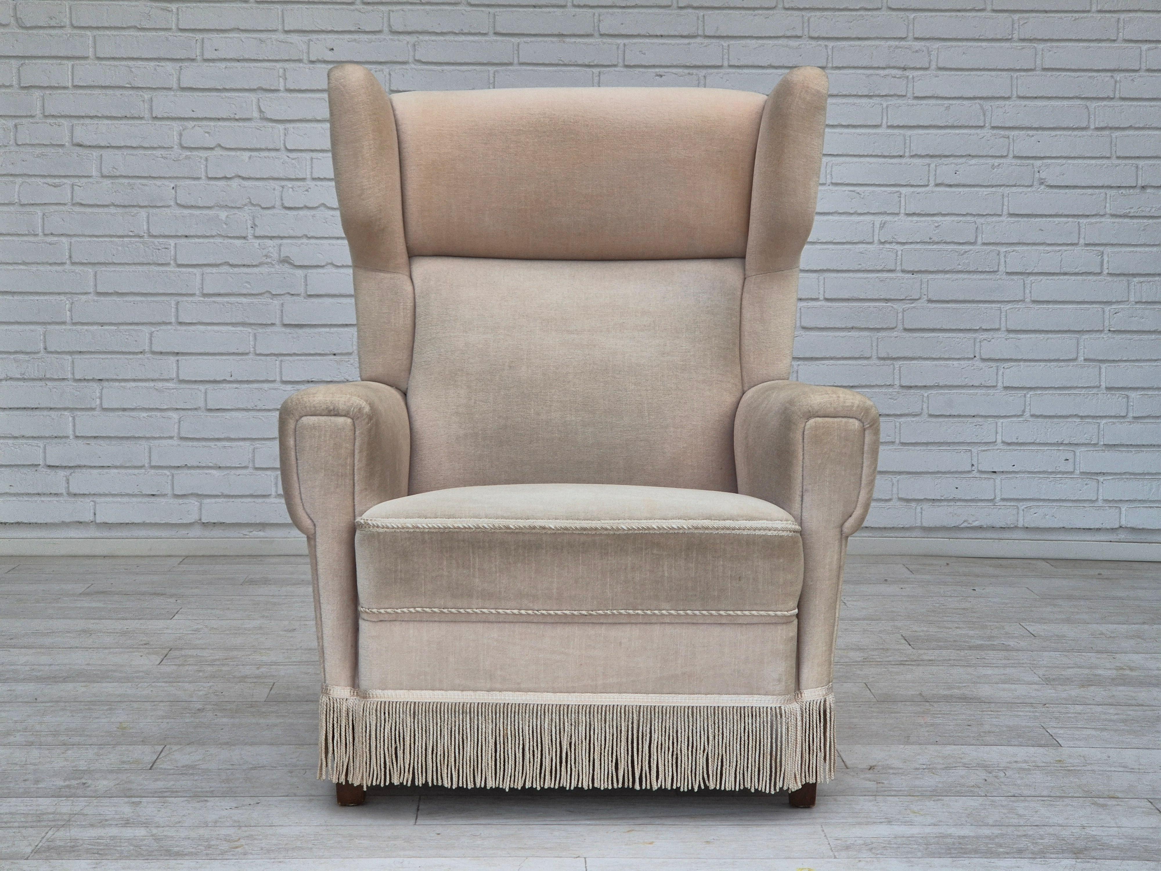 Scandinavian Modern 1970s, Danish wingback armchair, original condition, furniture velour, ash wood. For Sale