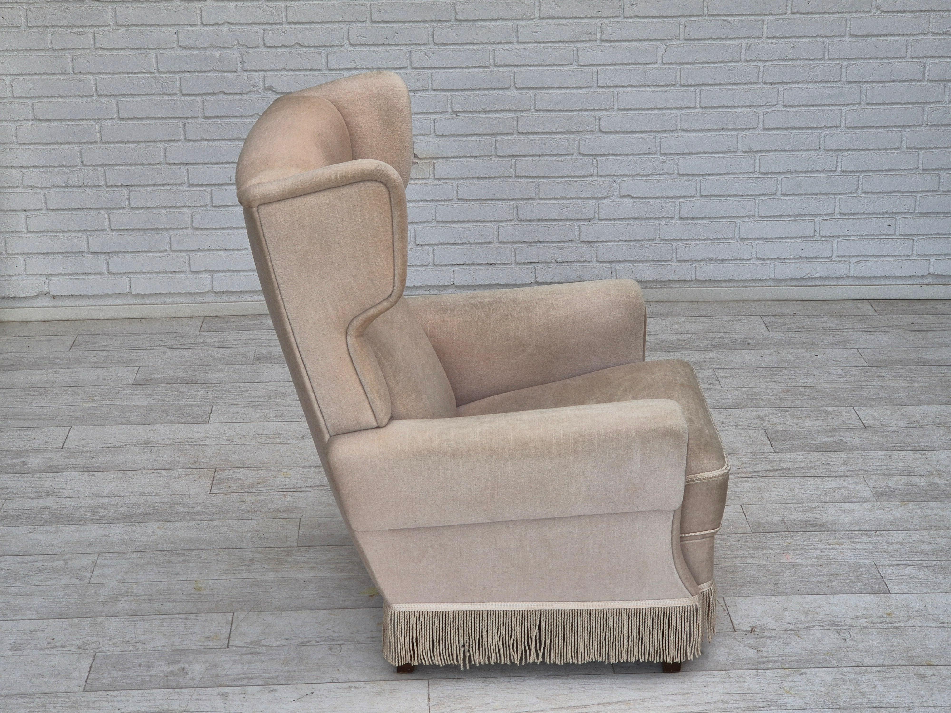 Late 20th Century 1970s, Danish wingback armchair, original condition, furniture velour, ash wood. For Sale