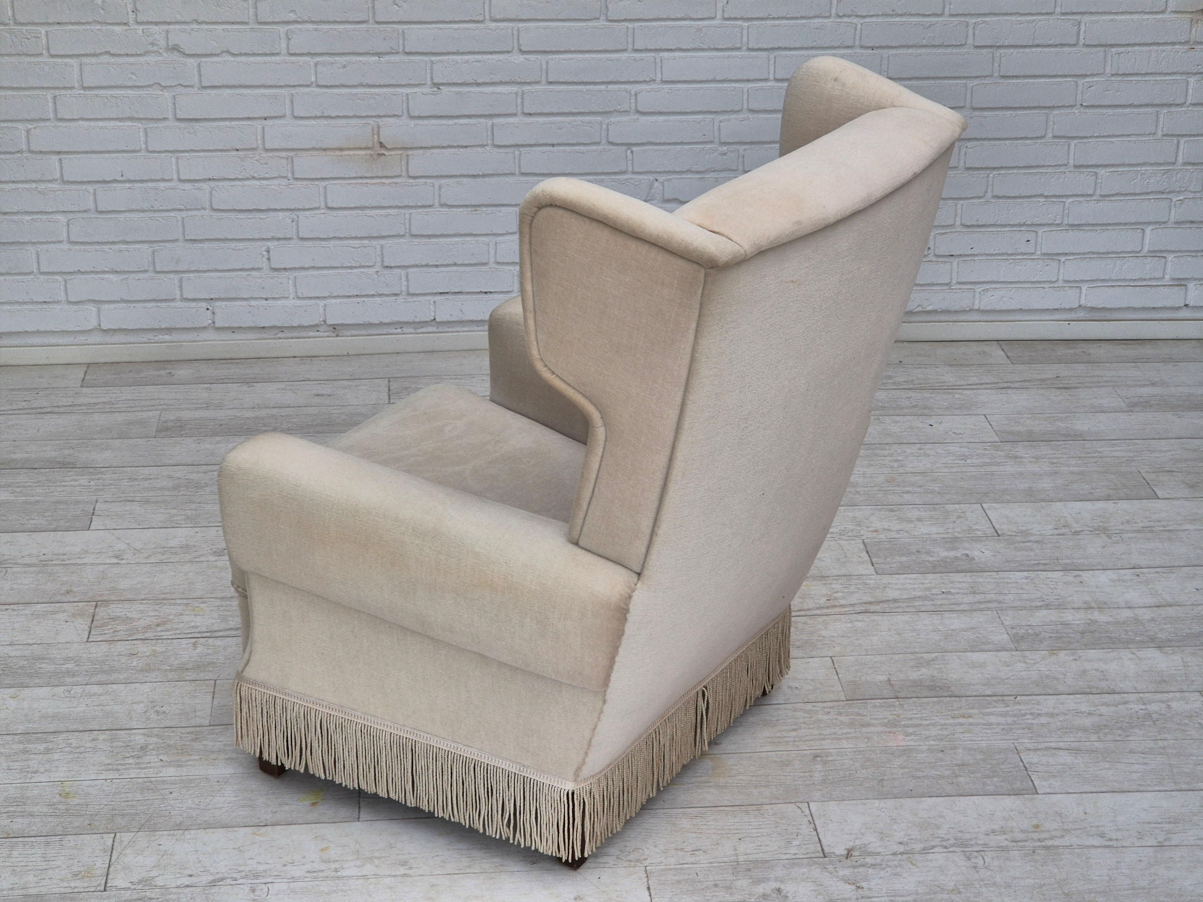 1970s, Danish wingback armchair, original condition, furniture velour, ash wood. For Sale 1