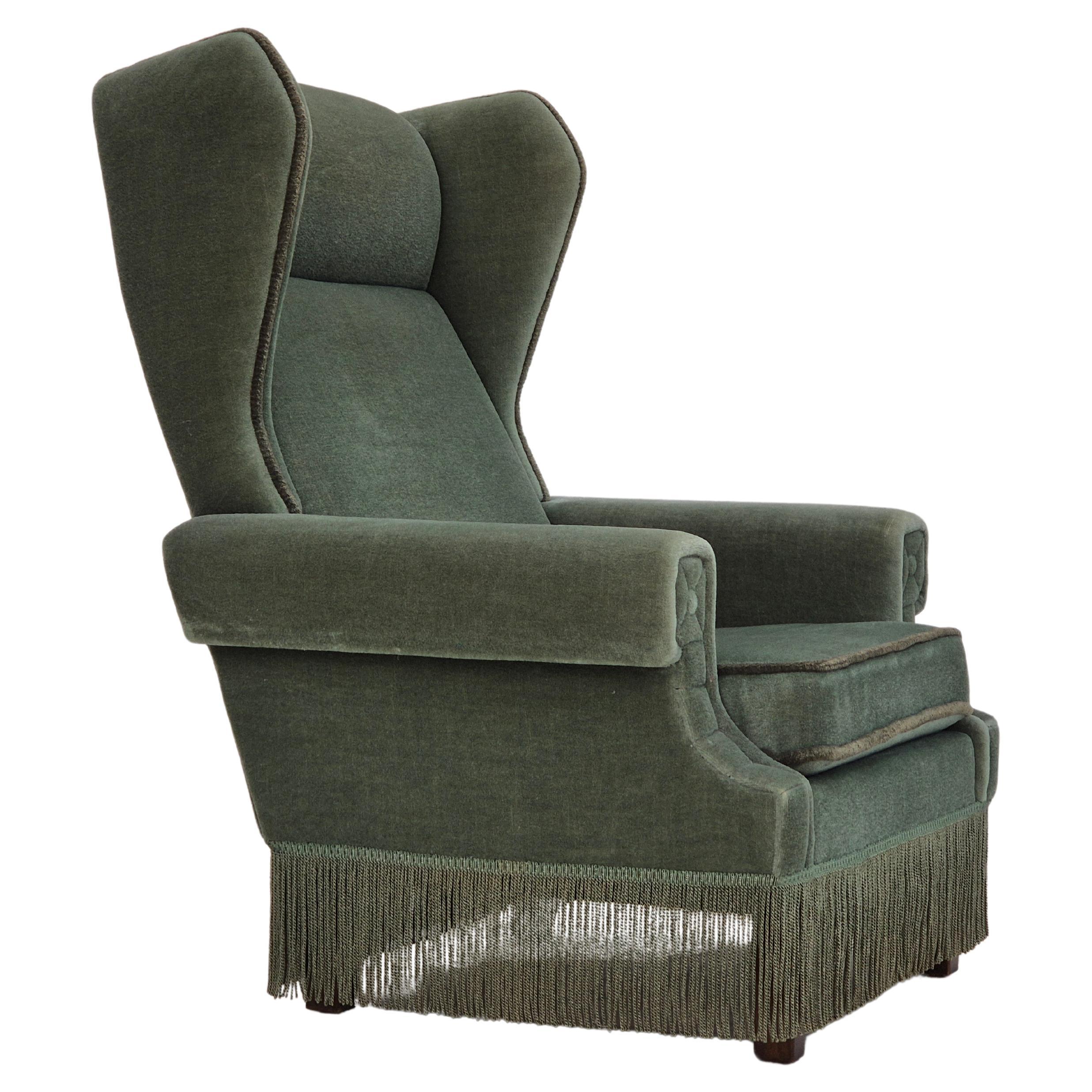 1970s, Danish wingback armchair, original condition, furniture velour, beech. For Sale
