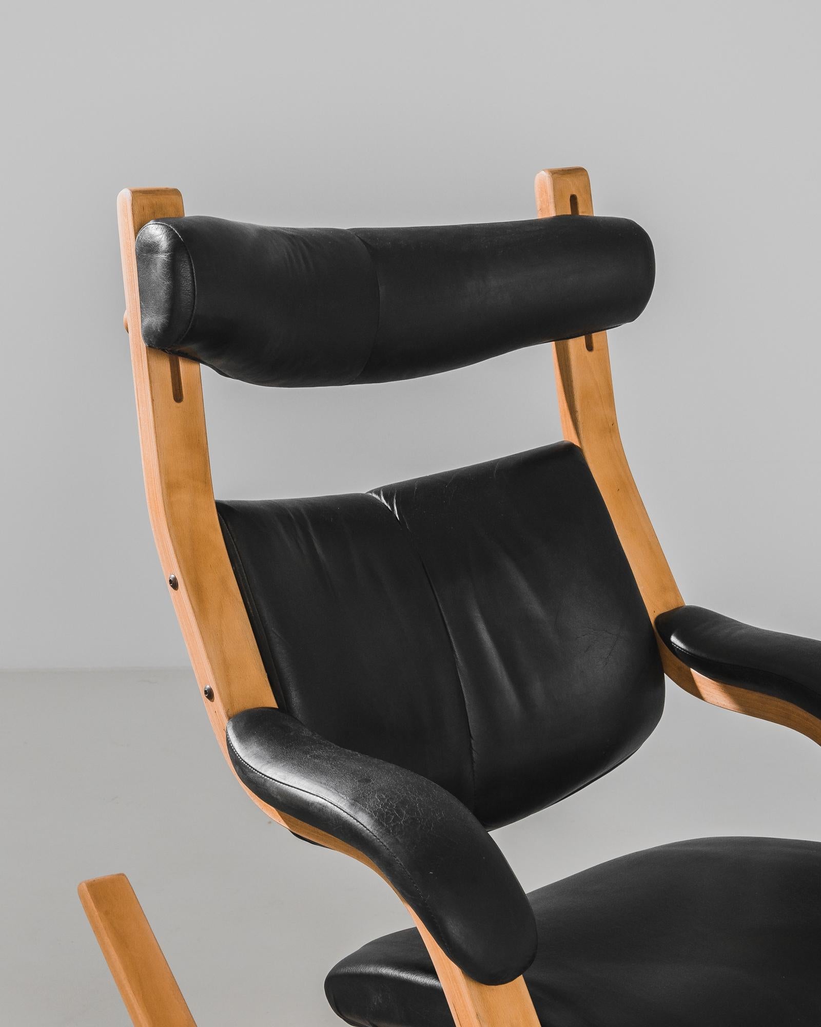 Unwind in the sculptural elegance of this 1970s Danish Rocking Chair, a masterpiece designed by Peter Opsvik for Stokke. This iconic piece combines the warmth of smooth wood with the luxurious comfort of leather. With its ergonomic design, the chair