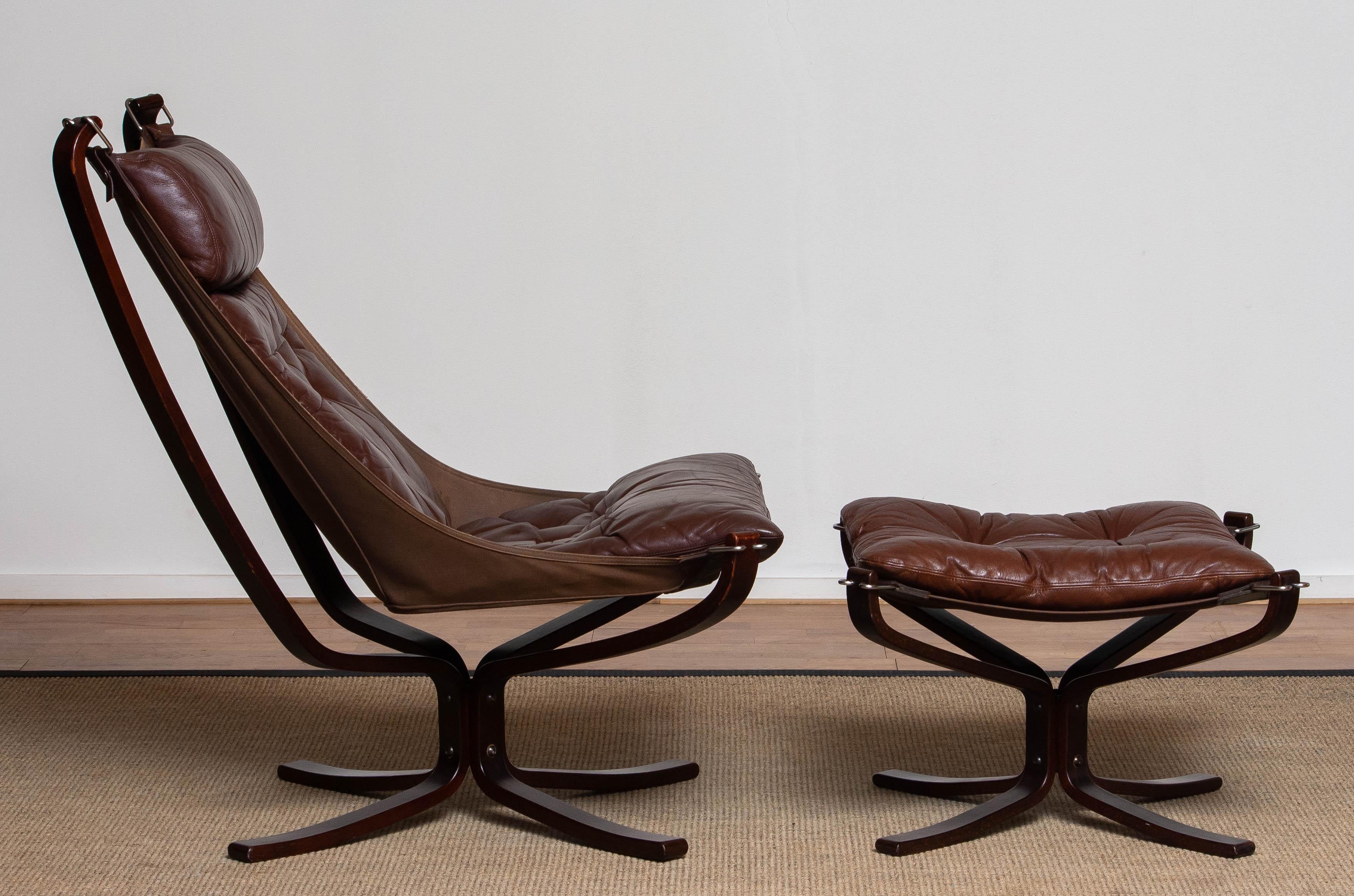 Beautiful set of 1970's chocolate brown 'Falcon' highback lounge chair and ottoman designed by Sigurd Ressel for Vatne Möbler in Norway.
This 'Falcon' chair is in overall good condition and the leather shows a great patina true the years.
   
 