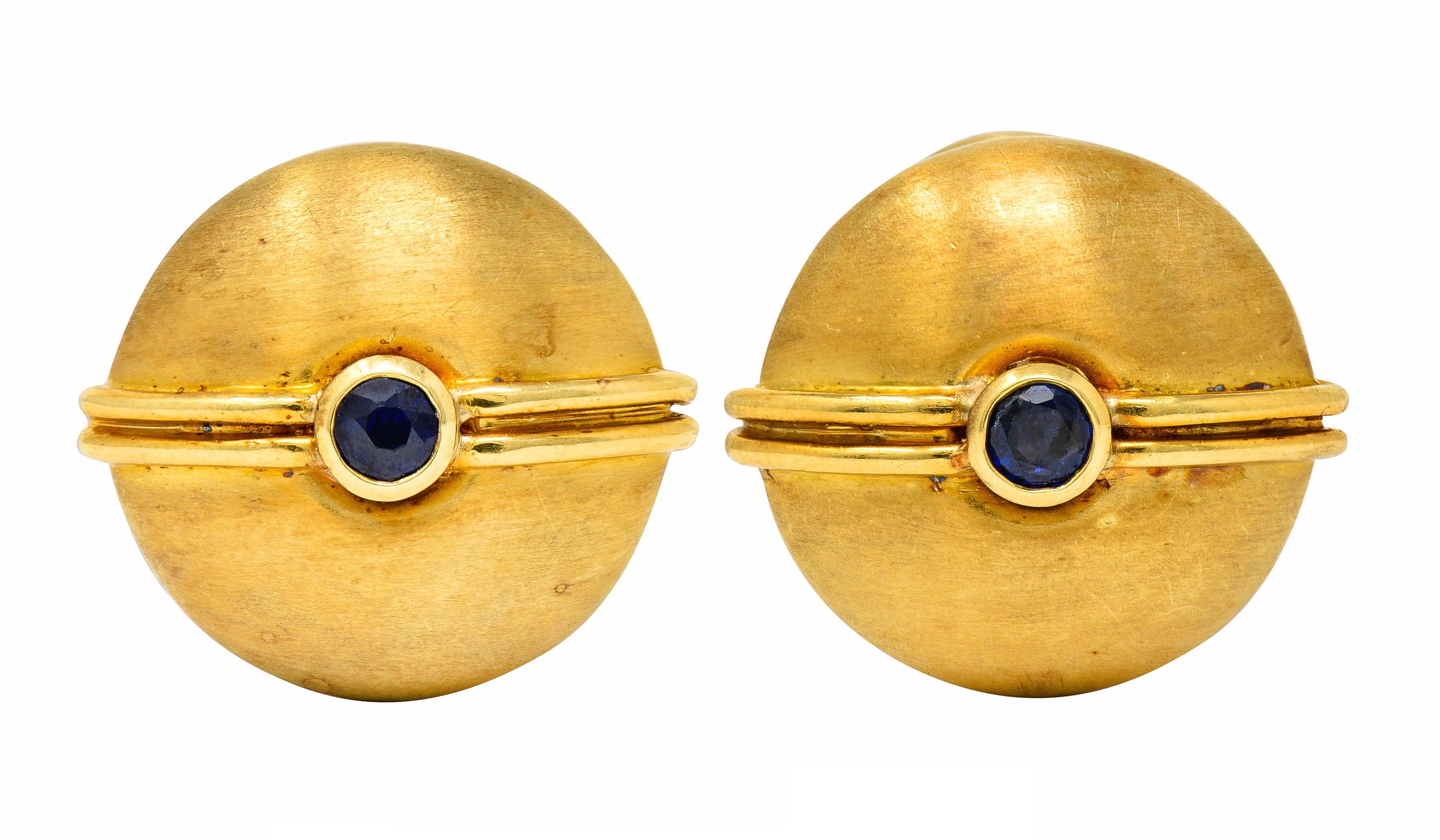 Featuring lever style cufflinks that terminate as round and domed spheroid forms

Exhibiting a strongly brushed finish with prominent ribbing that centers a bezel set and round cut sapphire

With three matching leverback shirt studs

Sapphires are a