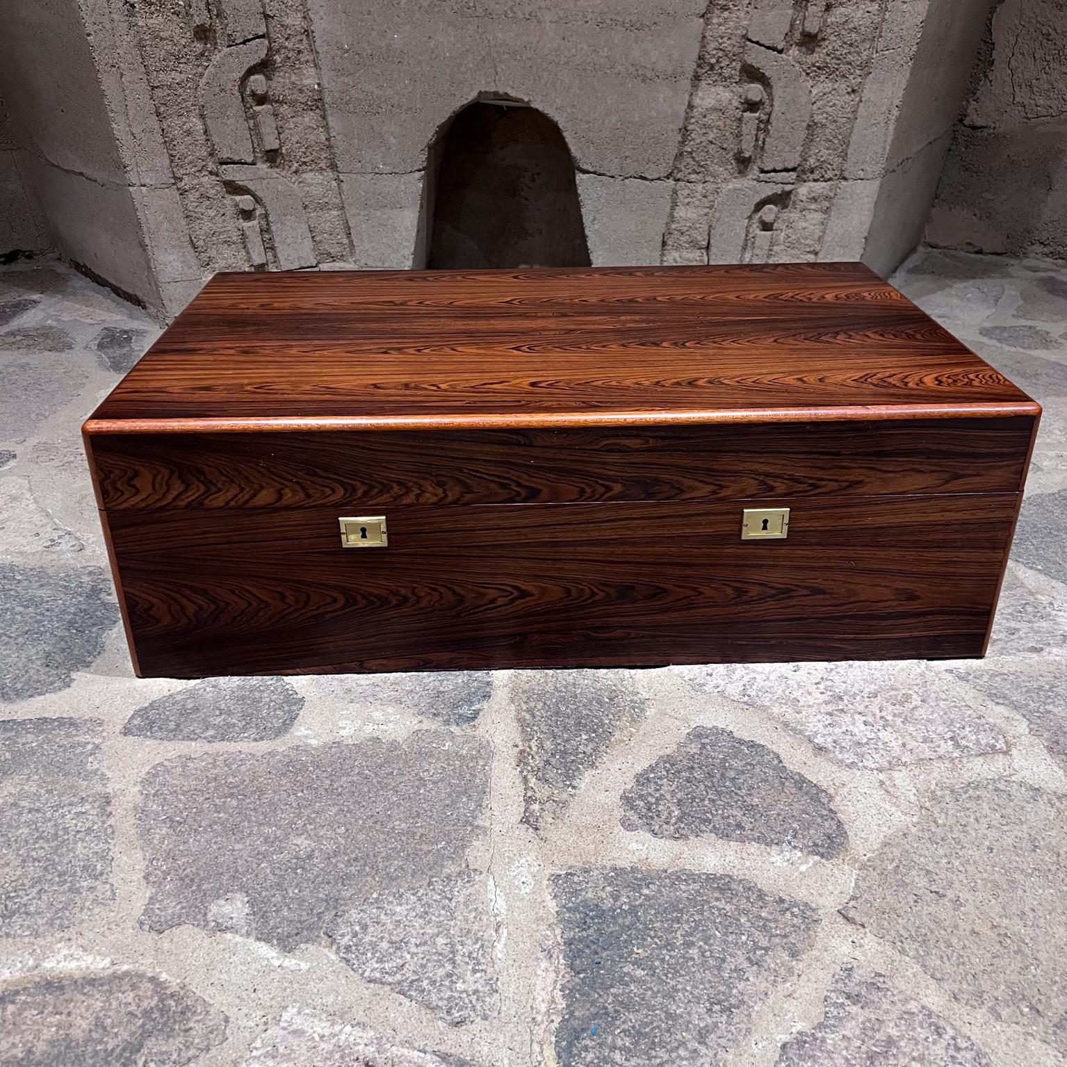 1970s Extra Large Rosewood Cigar Humidor Box
Campaign Brass Handles
made by Davidoff Switzerland
Luxurious Swiss design
10 h x 19.75 d x 31.5 w
Signature on handles.
Brass has patina.
Original vintage restored condition.
See all images provided