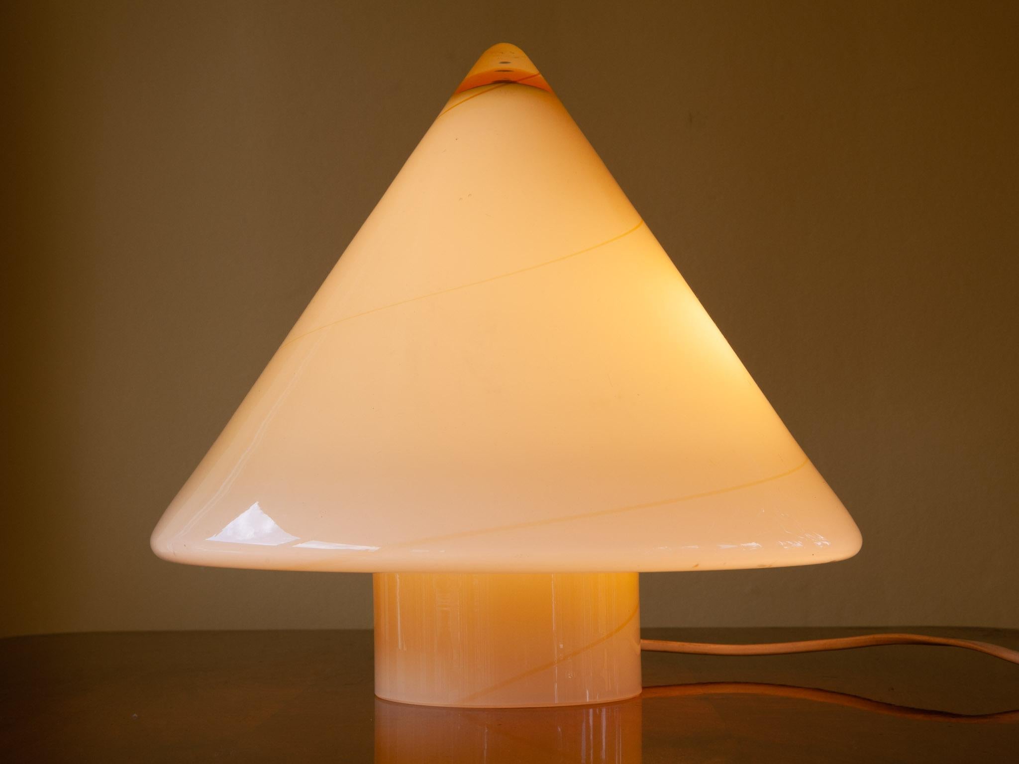 1970s De Majo thick Murano Italian glass yellow conical pyramid illuminated table lamp. A deeper yellow feature swirl covers the circumference of the lamp starting from the top. An unusual and rare lamp in perfect condition. PAT tested.