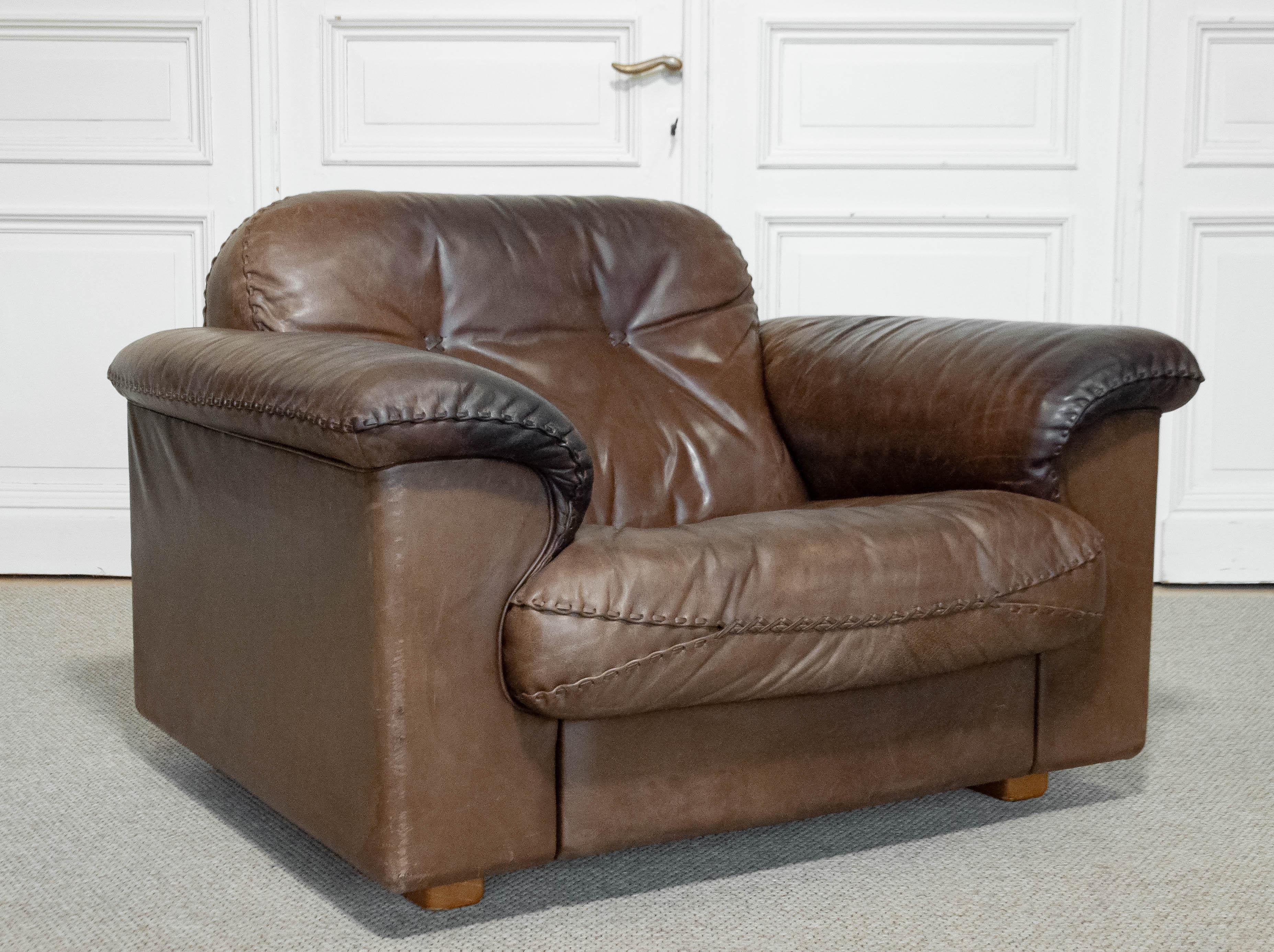 A De Sede DS-101 reclining lounge chair , Switzerland, 1970s. Upholstered in rich brown leather with hand-stitched detailing, this iconic relax chair feature adjustable seat mechanisms for maximum comfort. .A classic chair by the renowned Swiss