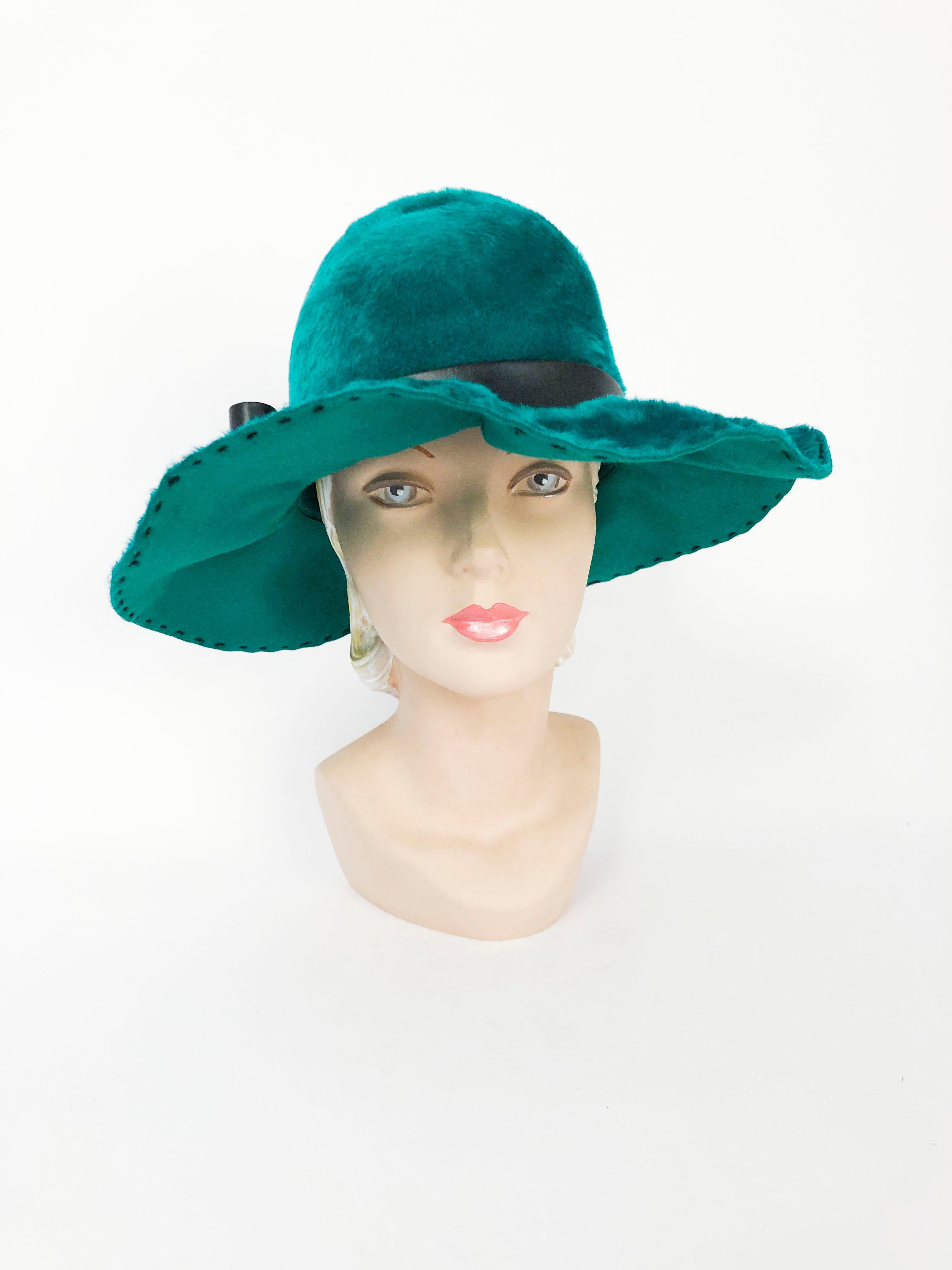 1970s Teal/Green rabbit felt hat with black topstitch along the brim and across one side of the top. Black faux leather band and bow and a shaped crown