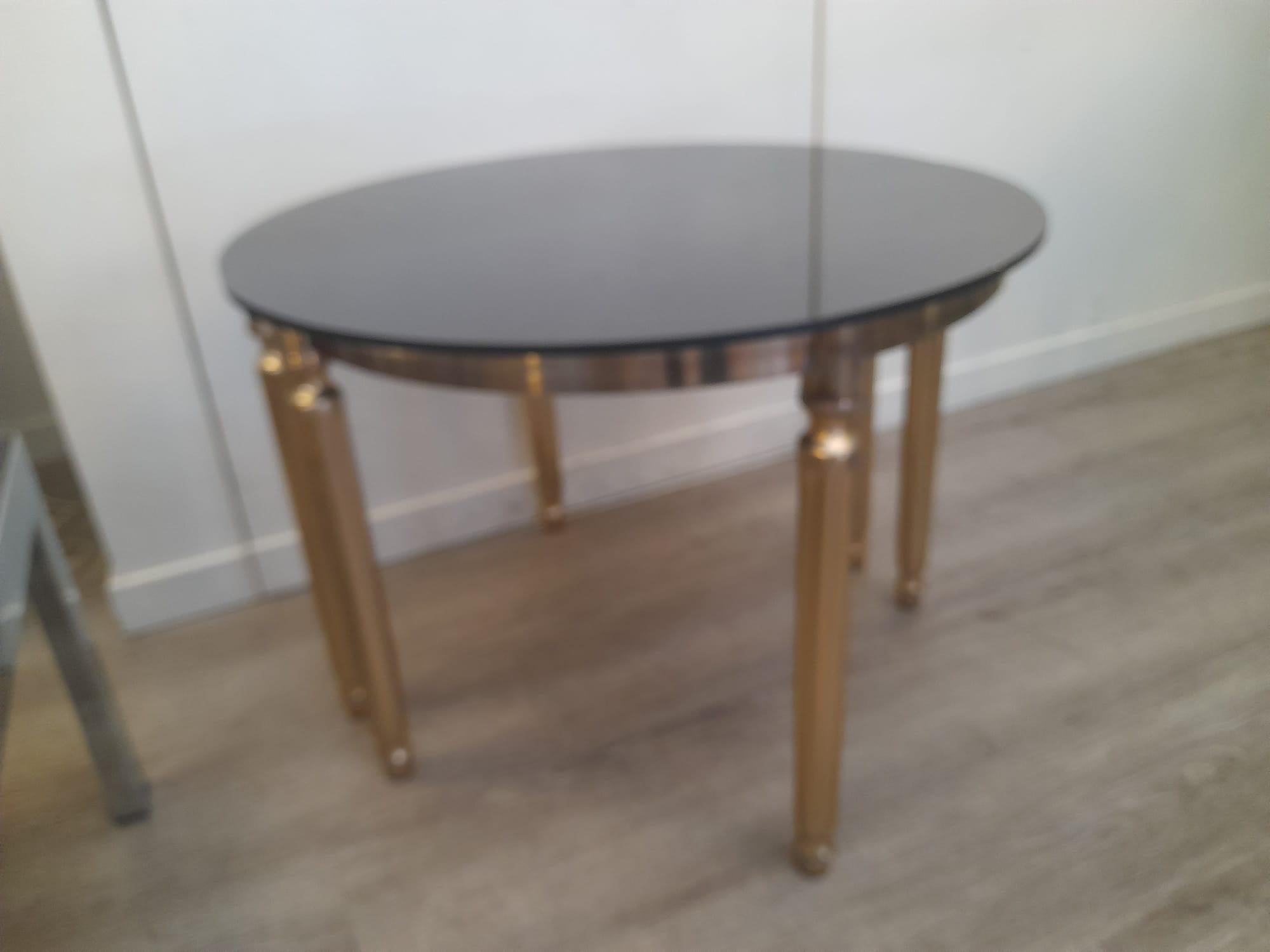 1970s Demi-lune golden metal smoked glasses small tables.

These identical tables can be put together to form a rounded only table.
They have golden metal structure showing some wears coherent with age and use (see pictures as a part of