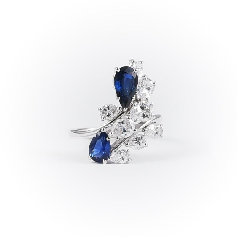 Made in 1970's with 2 pear cut sapphires 0.90 carats circa and 8 diamonds 1.20 carats circa in 18k white gold