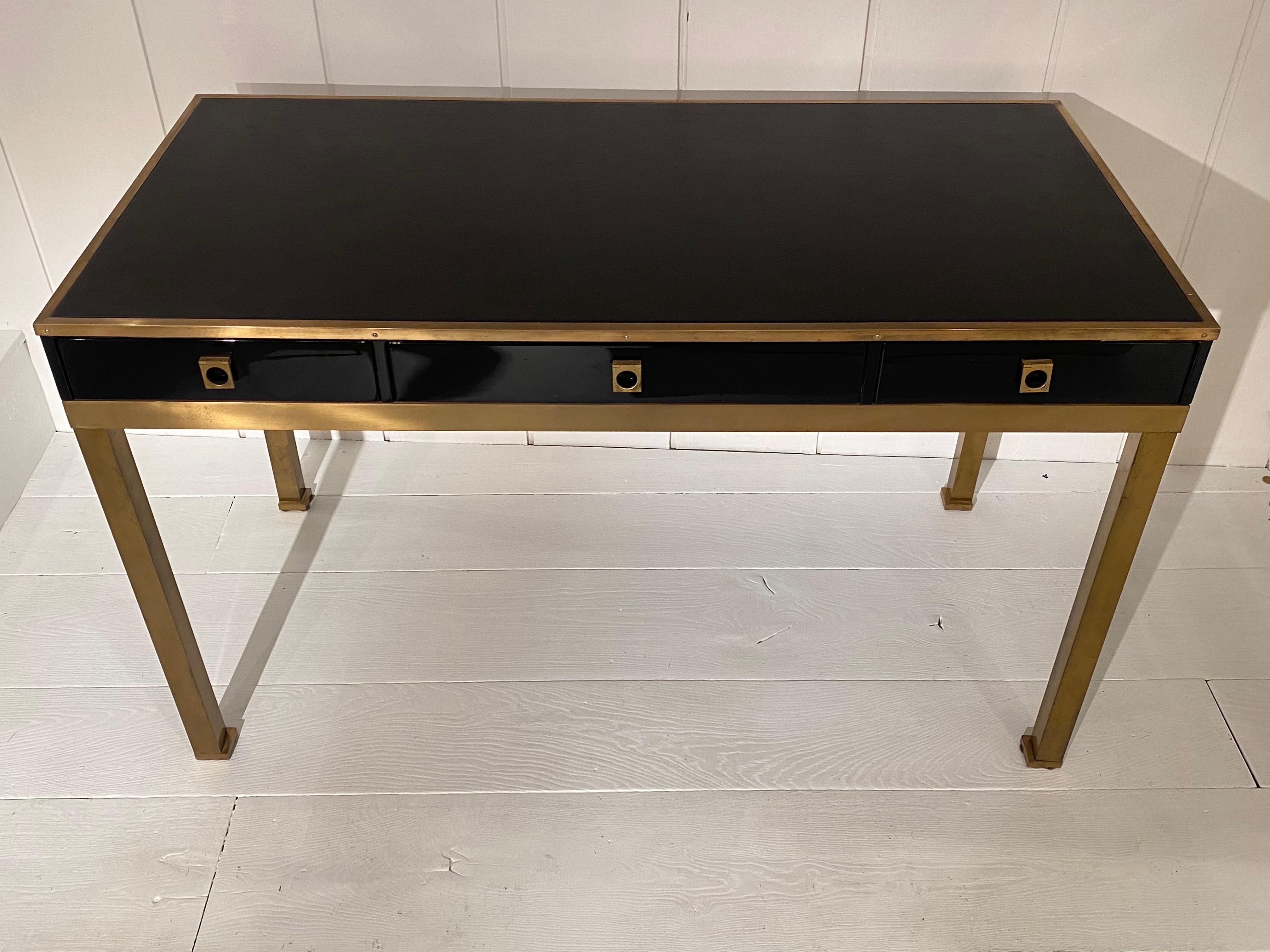 1970s elegant black lacquered and leather top desk by Guy Lefevre for Maison Jansen
Brass feet and handles
Three drawers with wood interior.
good vintage condition.
 