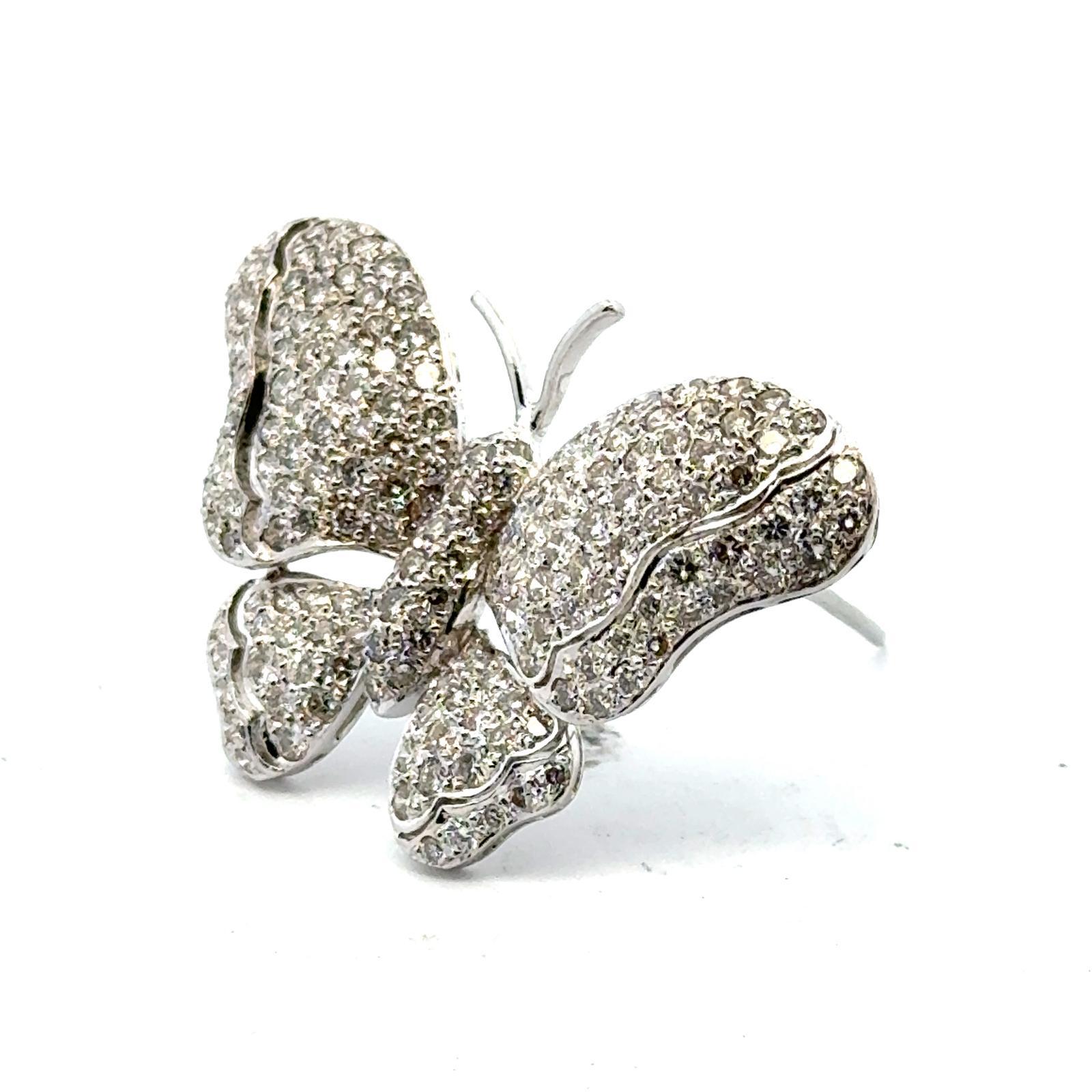 1970's diamond butterfly pendant and pin fashioned in 18 karat white gold. The butterfly features 180 round brilliant cut diamonds weighing approximately 3.50 carat total and are graded H-I color and SI clarity. The pendant measures 1.00 x 1.75