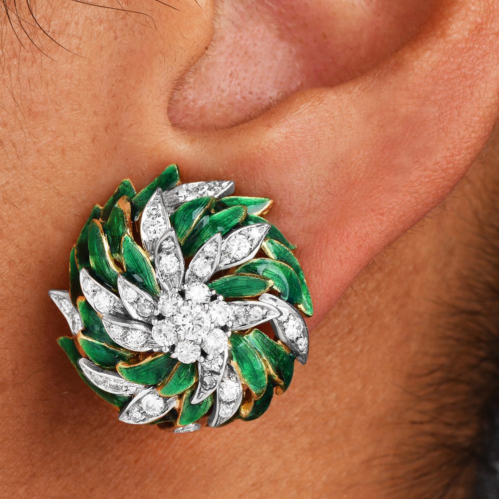 1970s Exquisite 18-karat white and yellow gold clip-on earrings. These enchanting spiral leaf designs feature lustrous green enamel petals, embracing a dome structure.

Flanking among these lively leaves are approx. 80 natural Round-cut diamonds,