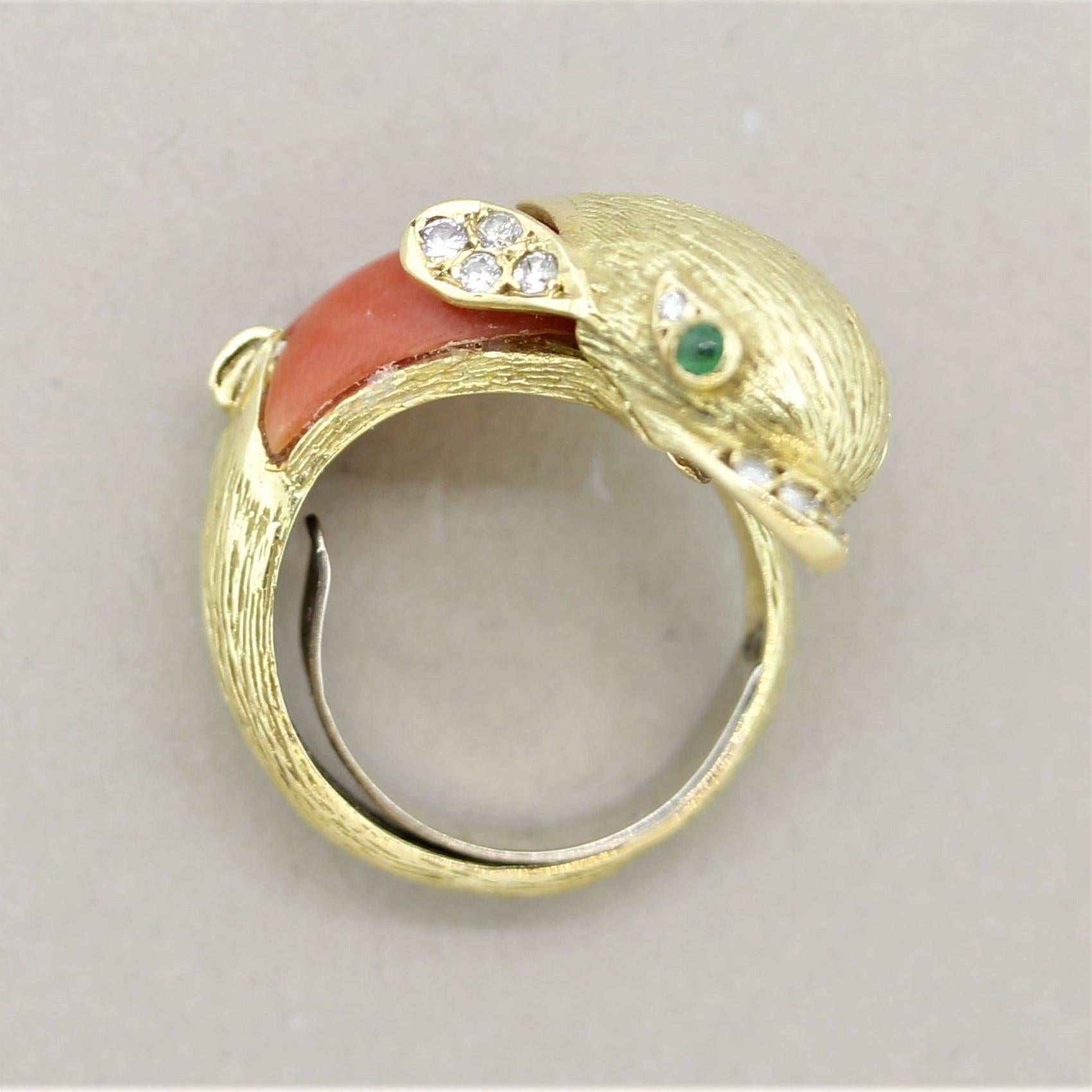 A sweet and stylish dolphin ring! It is made of a coral body with round brilliant-cut diamonds set as its beak and flippers and two emeralds are used as its mesmerizing eyes. Made in 18k yellow gold and ready to be worn! Circa 1970s’s.

Ring Size 5