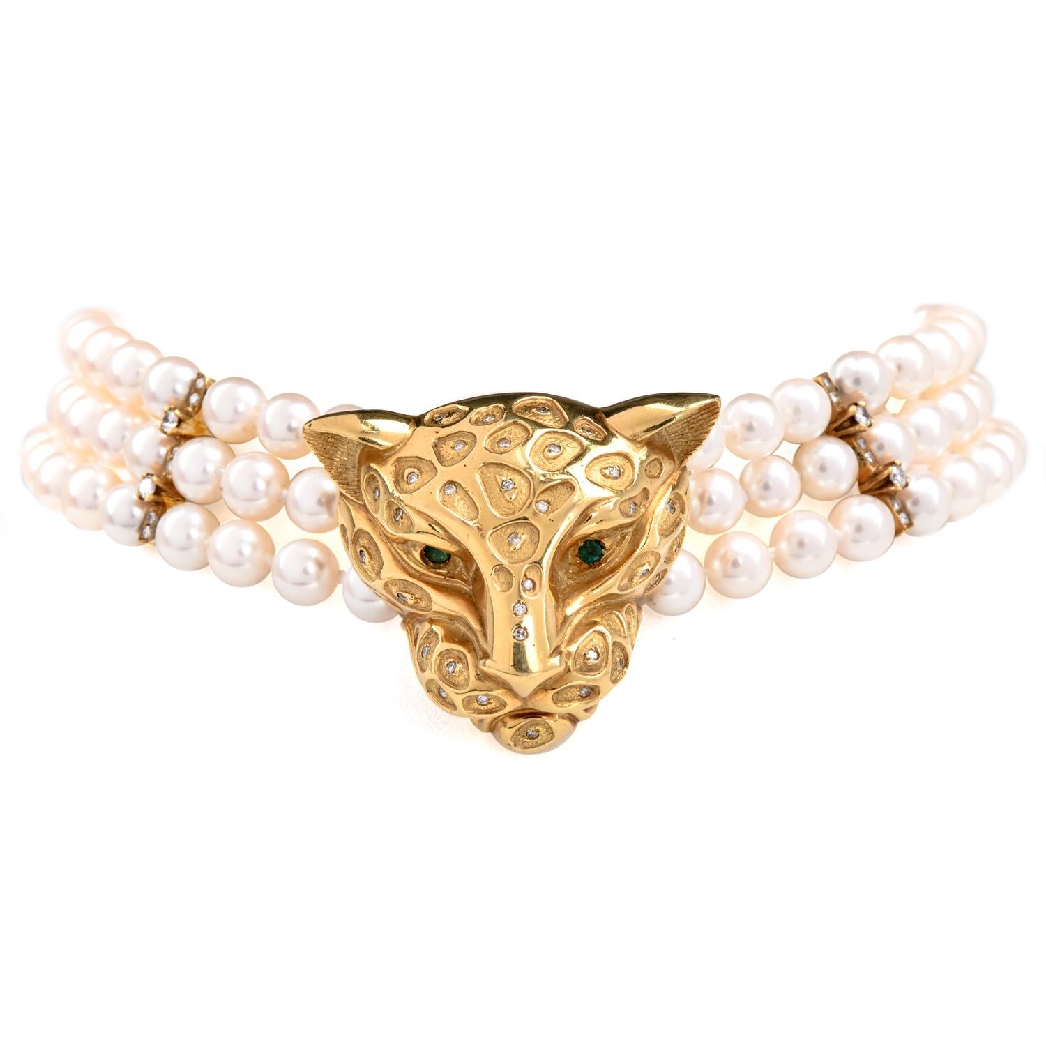 Presenting a remarkable estate jewelry piece: a pearl choker necklace featuring an opulent panther head clasp adorned with diamonds and emerald eyes, all set in luxurious 18K yellow gold. This captivating choker necklace is formed by three strands