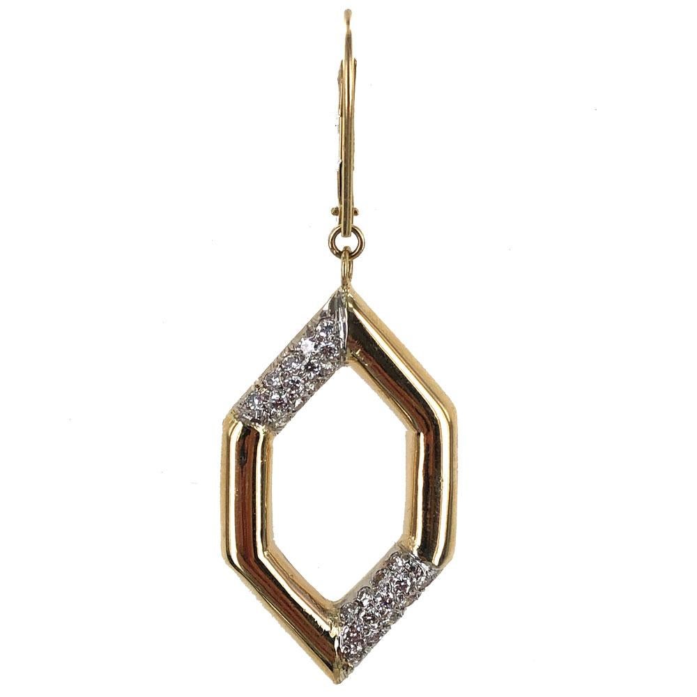 Stylish diamond drop earrings fashioned in 18 karat yellow gold. The geometric shape drops feature .76 carats of diamonds graded F-G color and VS clarity. The earrings measure 2.0 inches in length and .70 inches in width. 