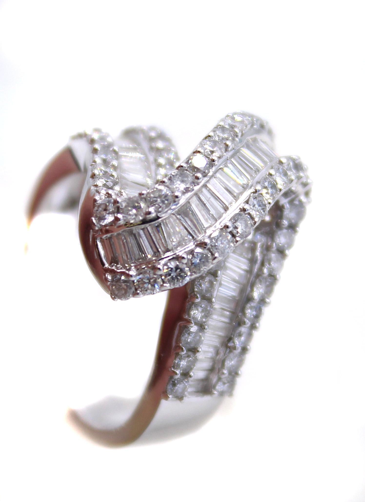 This abstract bold 1970s ring has been interestingly designed and well crafted to make for a unique look on the finger . A center row of baguette cut diamonds, bordered by a slightly elevated row of round brilliant cut diamonds on either side curves