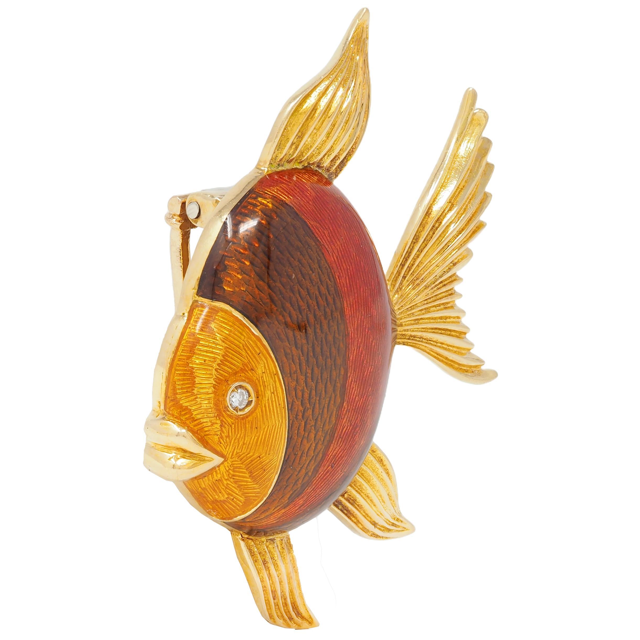 Designed as a stylized goldfish with fanning fluted gold fins
Body is decorated with stripes of guilloche enamel 
Transparent orange, reddish-orange, and copper 
Glossed over radial engraving - minimal loss
Accented by a round brilliant cut diamond
