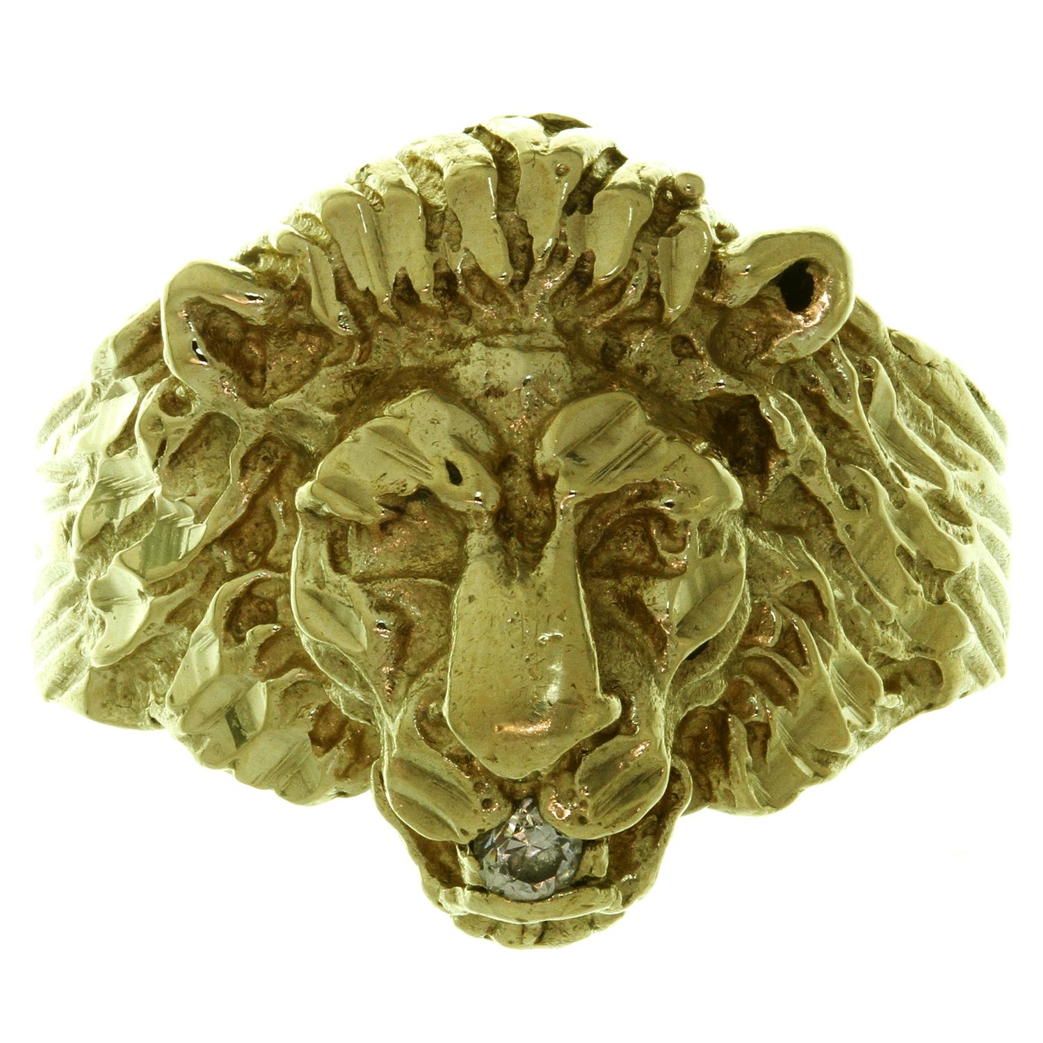 This fabulous vintage men's ring features the shape of a lion's head crafted in 14k yellow gold and accented with a solitaire round diamond of an estimated 0.06 carats. Made in United States circa 1970s. Measurements: 0.75