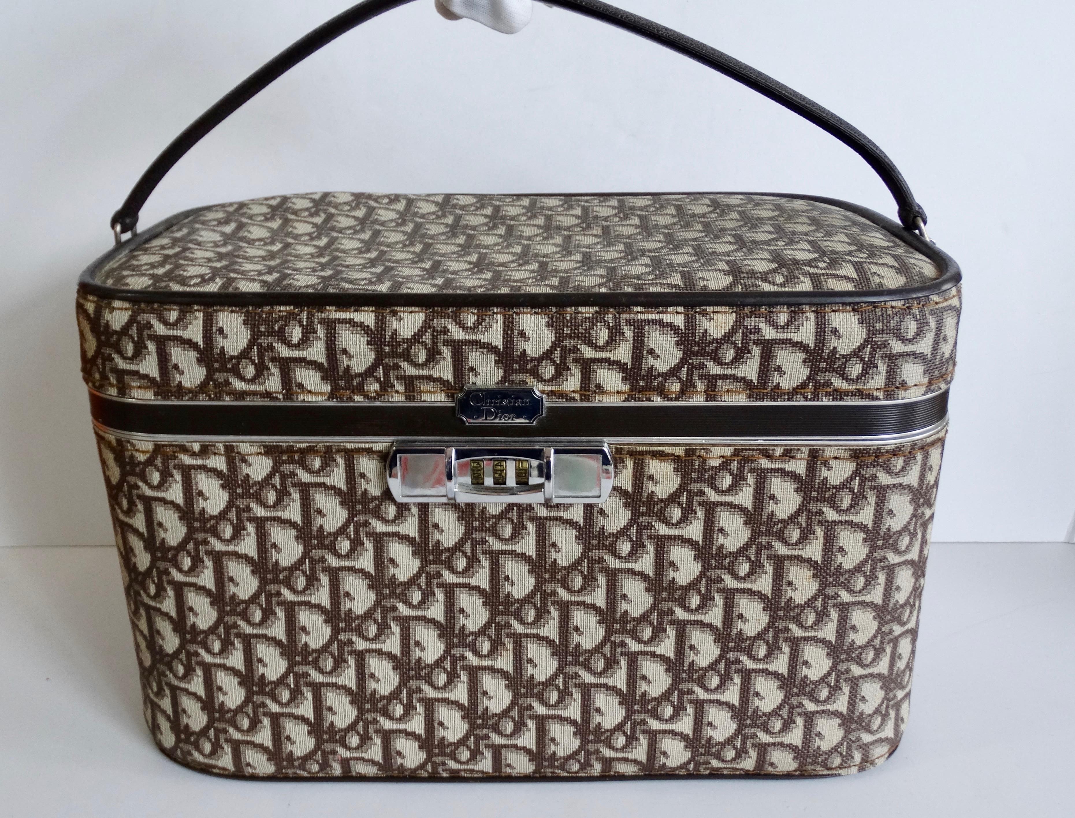 The logo mania trend of the 2000s is back- rock a piece of original 1970s monogram with our amazing Dior cosmetic case! Printed all over in Dior’s signature brown monogram print! Boxy, cosmetic case construction with stylish top handle. Features
